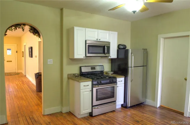 a kitchen with a stove and a refrigerator