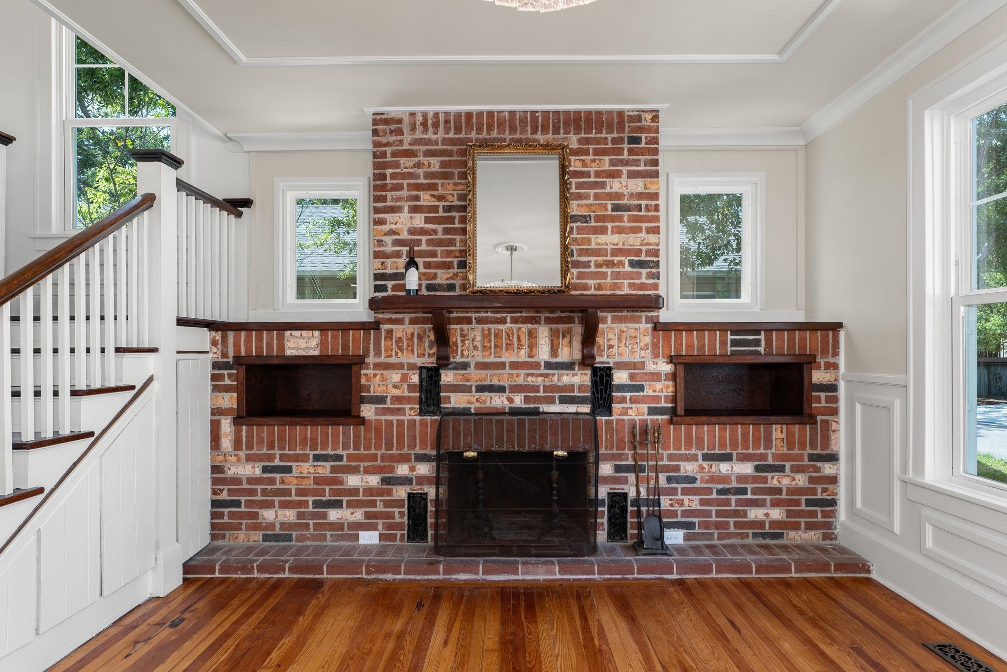 142 Washington Street St. Augustine, FL 32084 - Photo 19 of 53 a living room with fireplace furniture and a flat screen tv