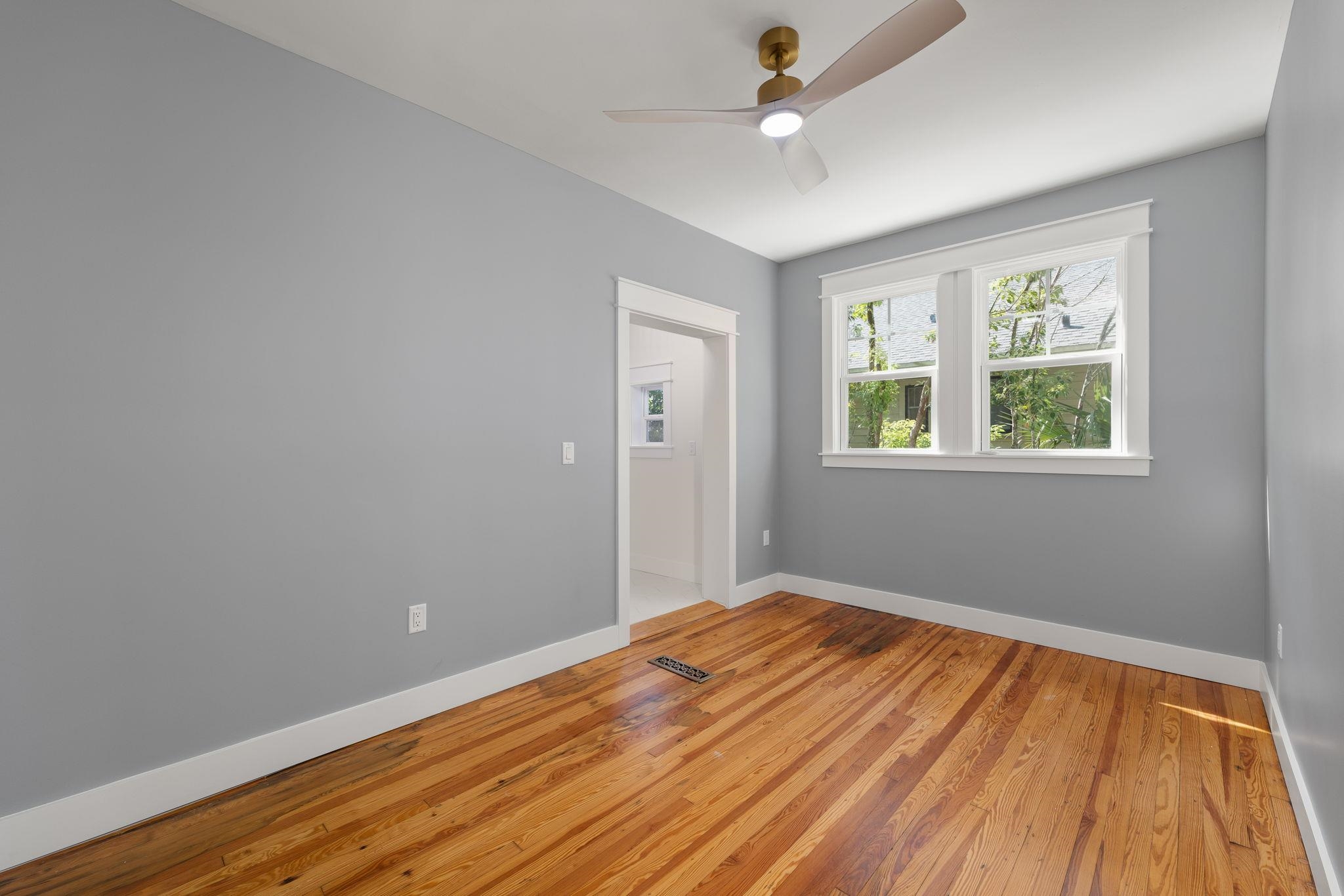 142 Washington Street St. Augustine, FL 32084 - Photo 30 of 53 a view of empty room with wooden floor and fan