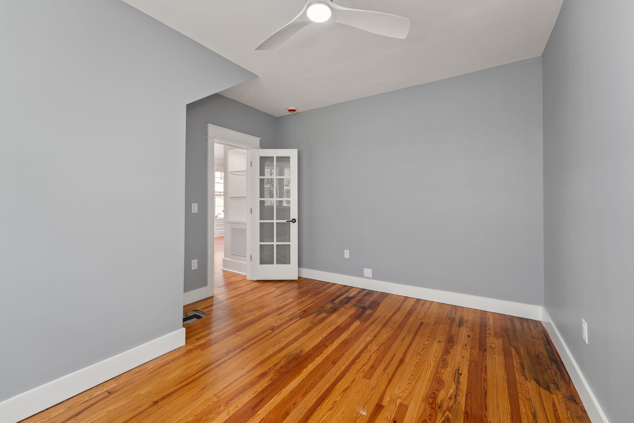 142 Washington Street St. Augustine, FL 32084 - Photo 31 of 53 a view of an empty room with wooden floor and a window