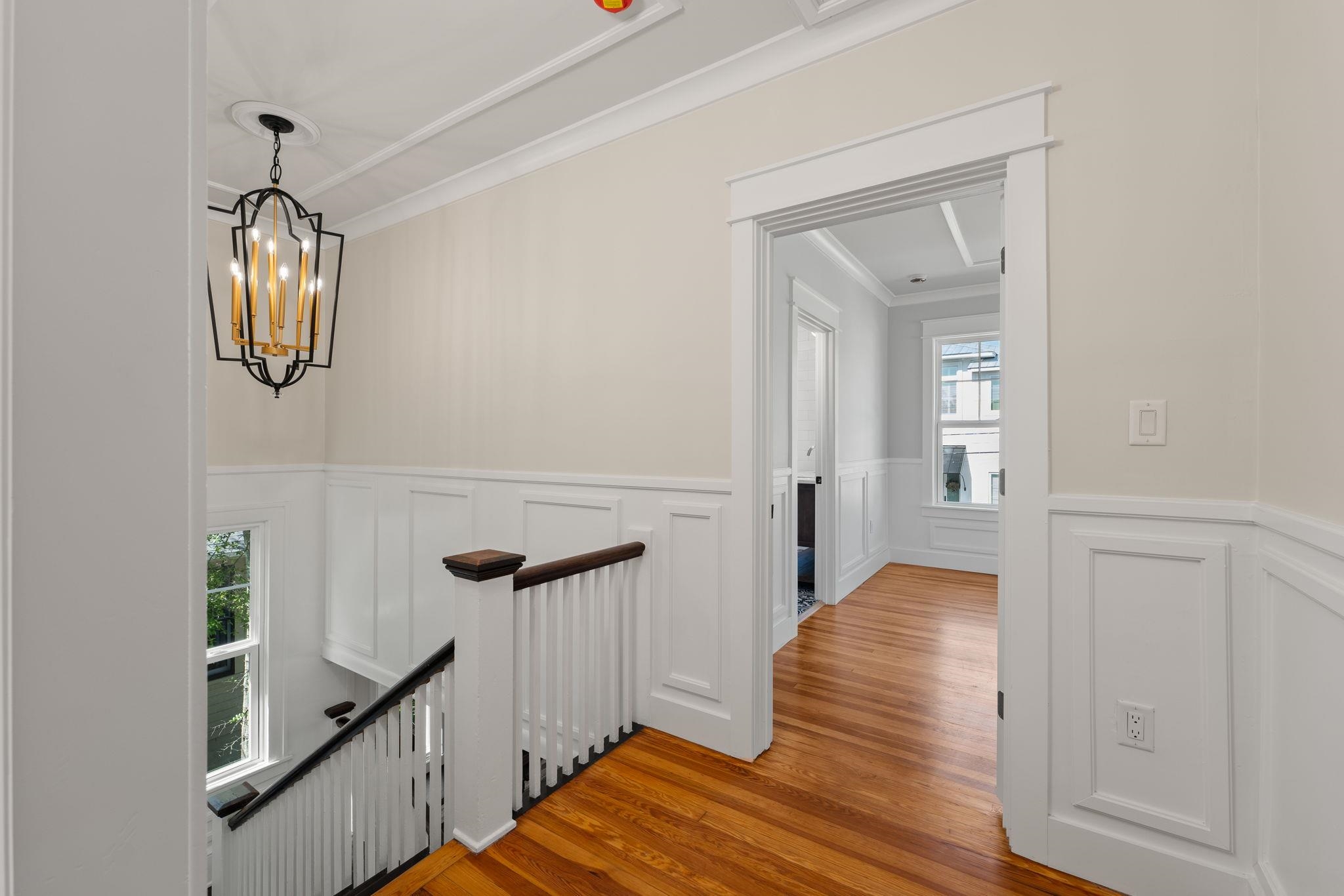 142 Washington Street St. Augustine, FL 32084 - Photo 34 of 53 a view of a hallway with wooden floor and staircase