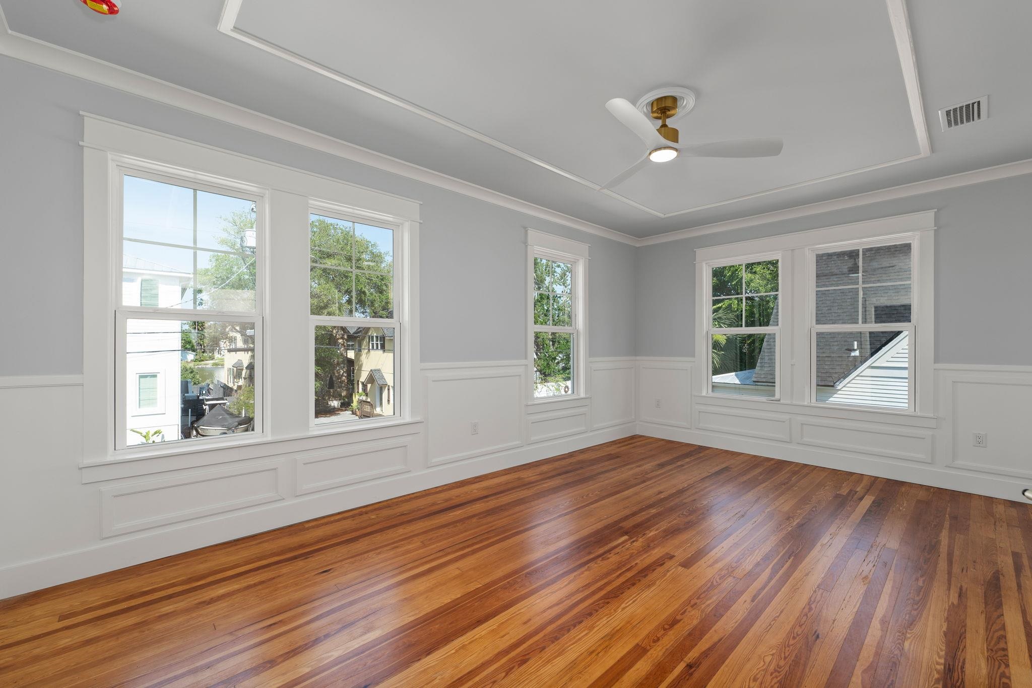 142 Washington Street St. Augustine, FL 32084 - Photo 35 of 53 a view of an empty room with wooden floor and a window