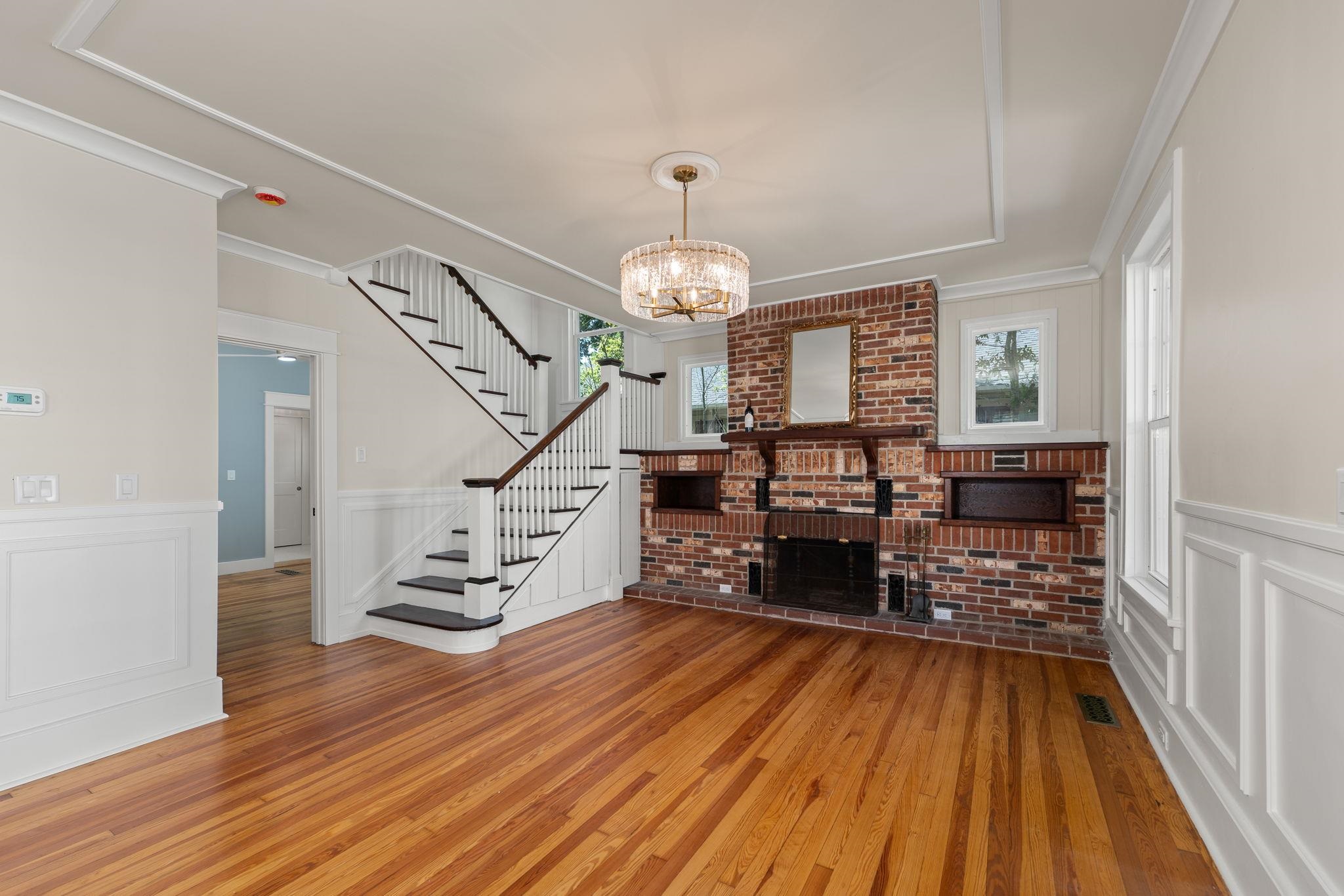 142 Washington Street St. Augustine, FL 32084 - Photo 4 of 53 a very nice looking room with wooden floor a chandelier