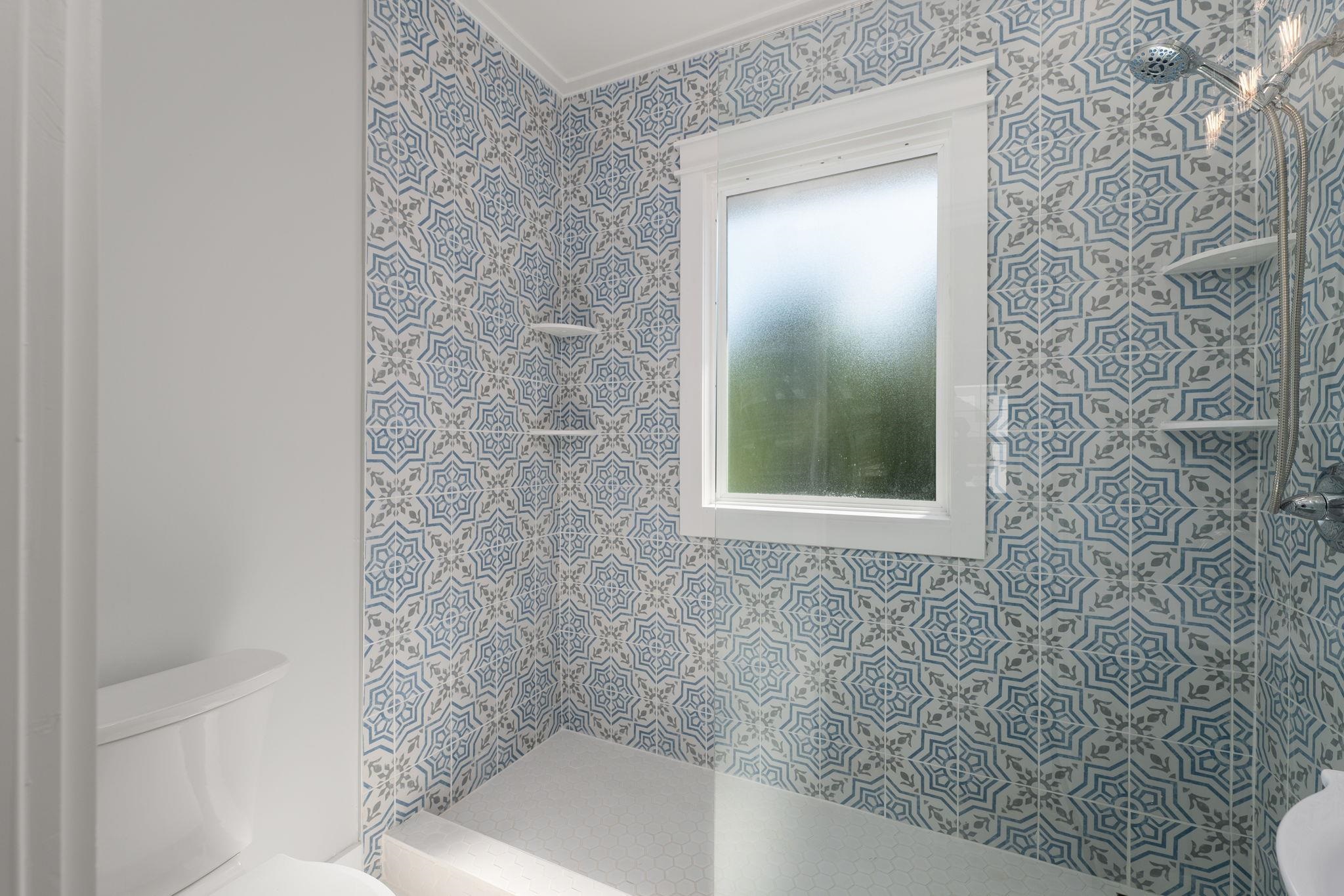 142 Washington Street St. Augustine, FL 32084 - Photo 45 of 53 a bathroom with a bathtub and shower
