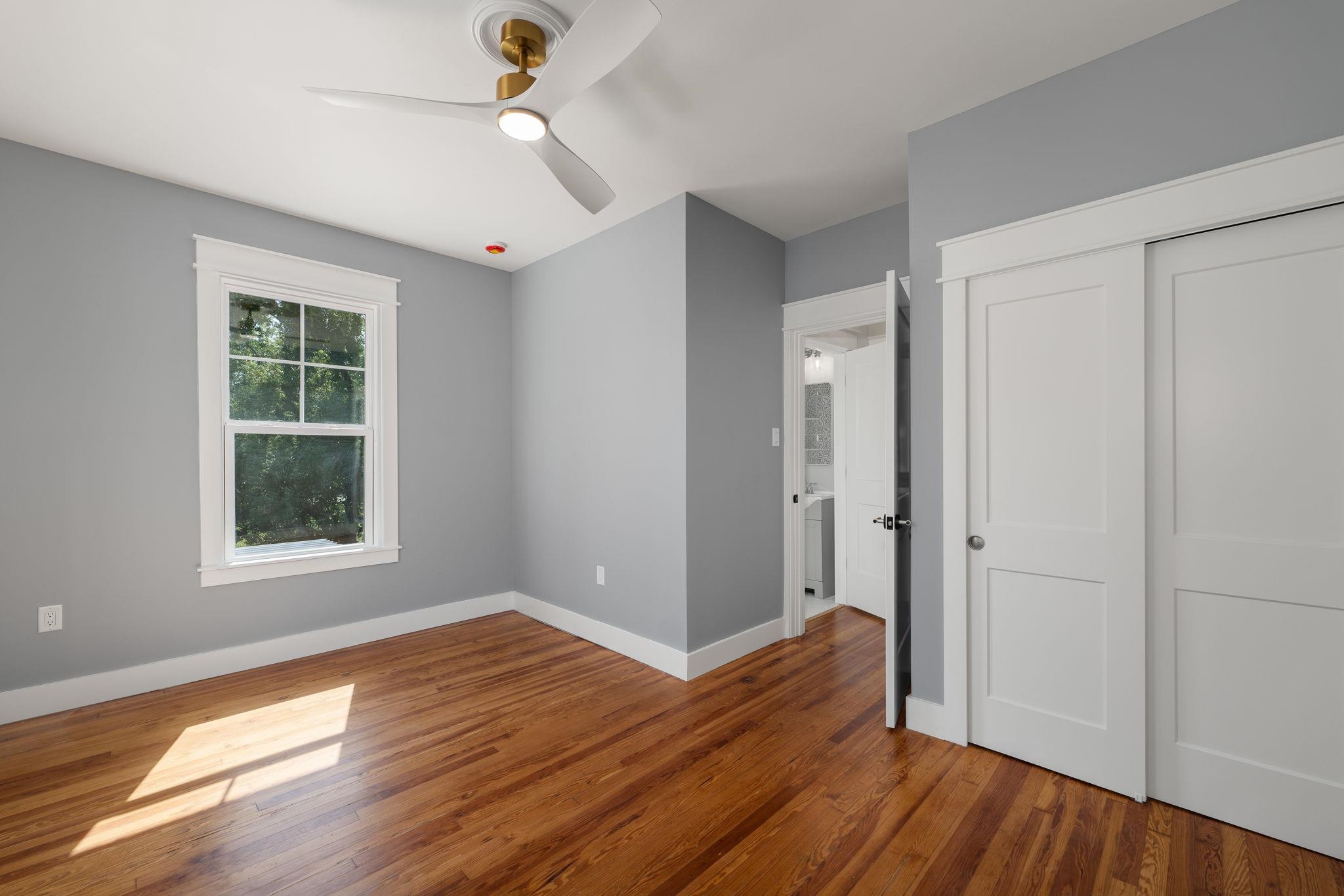 142 Washington Street St. Augustine, FL 32084 - Photo 46 of 53 a view of an empty room with wooden floor and a window