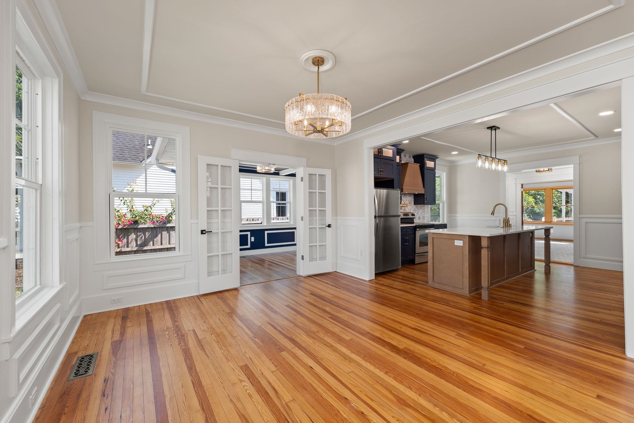 142 Washington Street St. Augustine, FL 32084 - Photo 5 of 53 a view of a kitchen and dining room with wooden floor