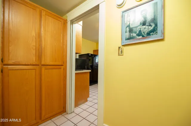 a view of a bathroom with sink and refrigerator