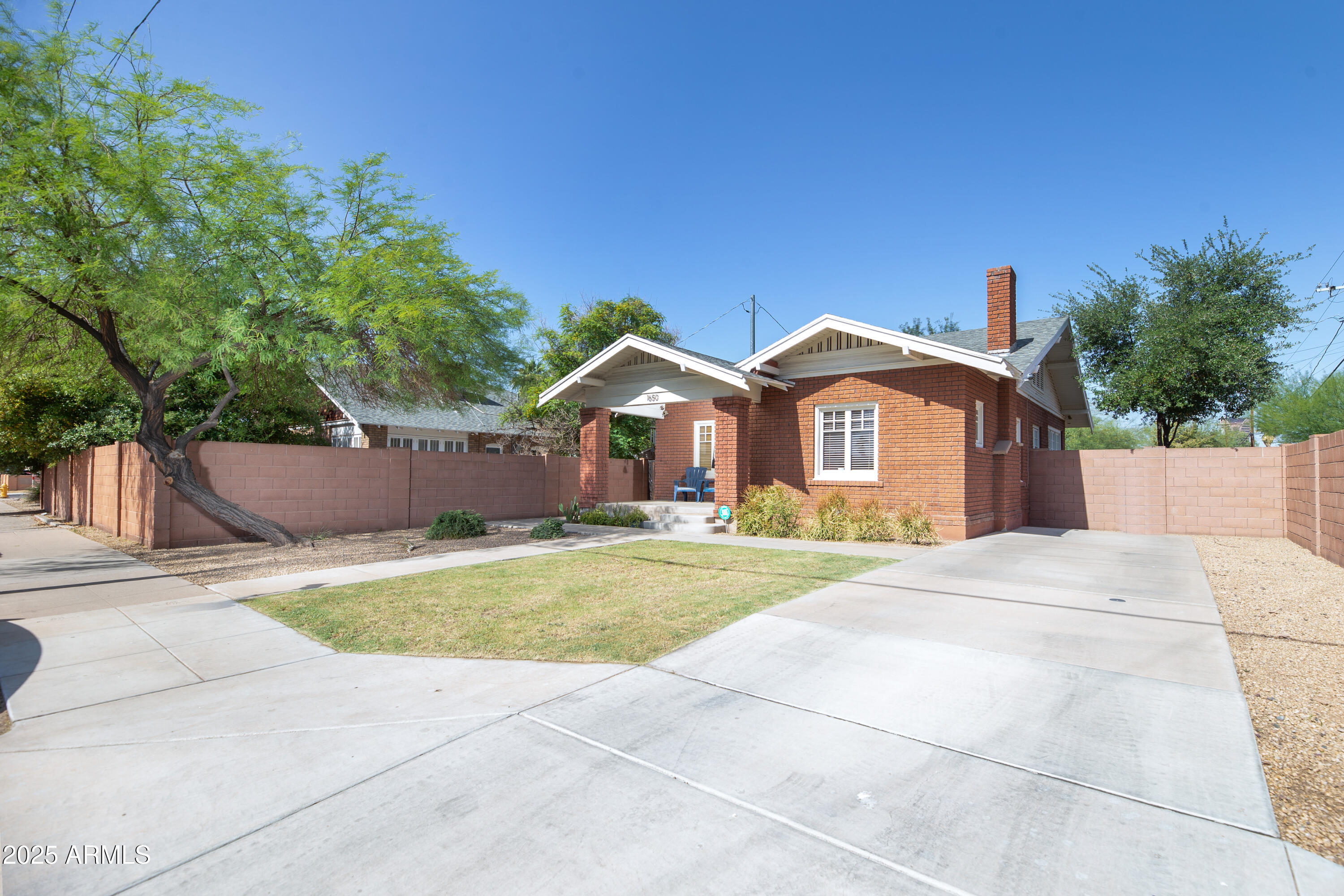 1650 North 10th Street Phoenix, AZ 85006 - Photo 2 of 29 a front view of a house with a yard and garage