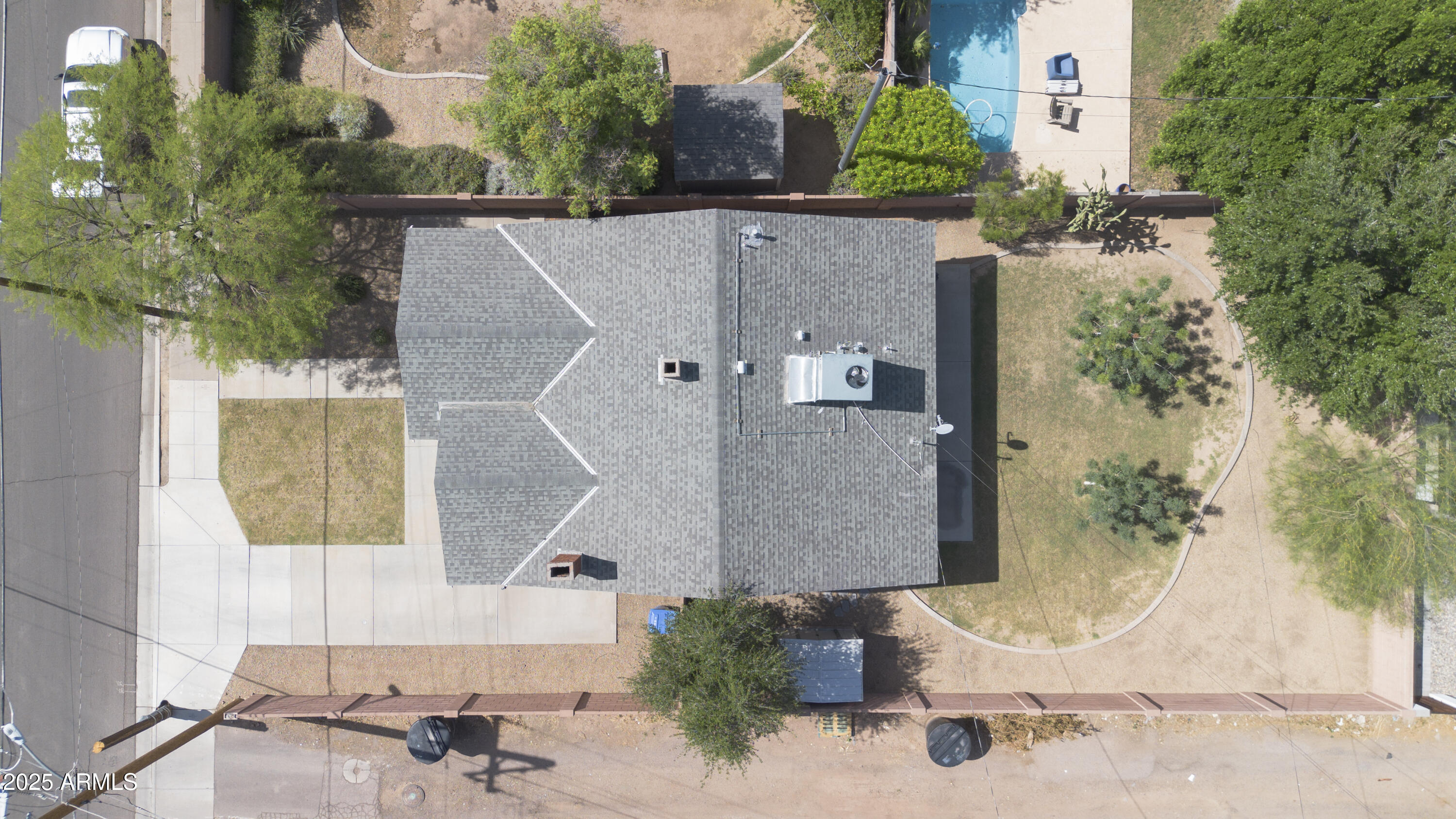 1650 North 10th Street Phoenix, AZ 85006 - Photo 28 of 29 an aerial view of a house with swimming pool and large trees