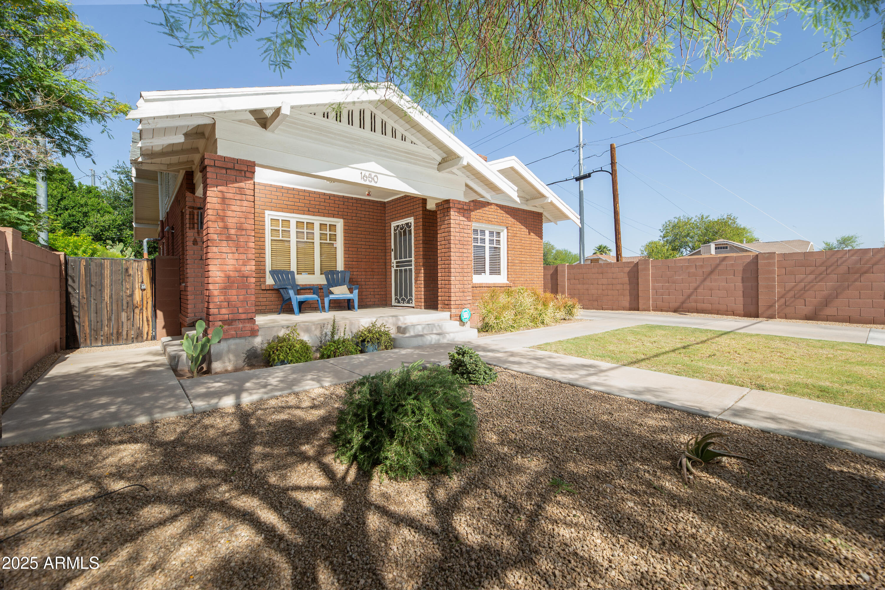 1650 North 10th Street Phoenix, AZ 85006 - Photo 3 of 29 a view of a house with a yard