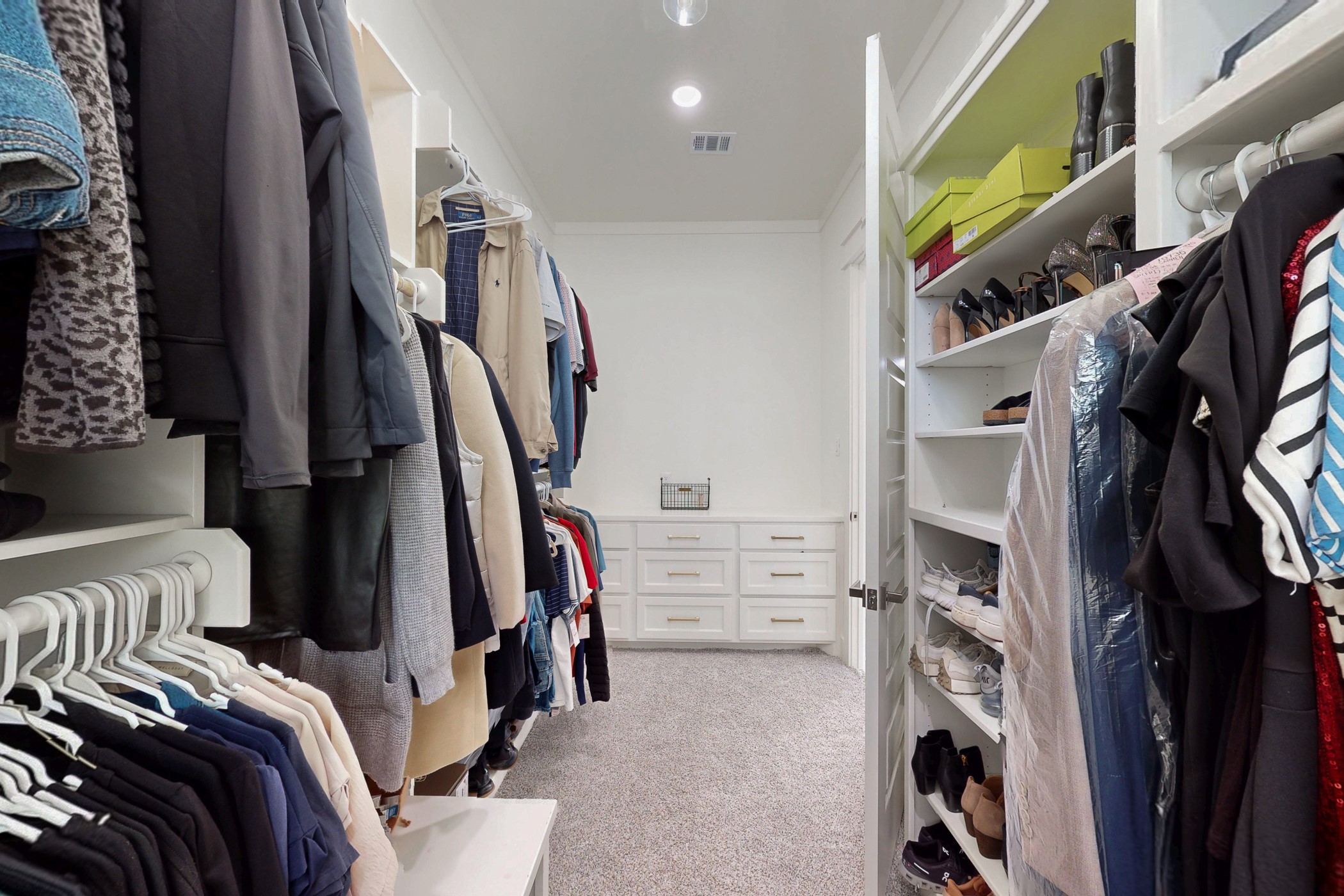 13504 Hudson Farms Road Franklin, TX 77856 - Photo 38 of 49 a view of walk in closet with clothes and shoes