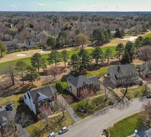 an aerial view of a house with a garden
