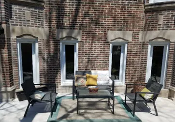 a building outdoor space with patio furniture