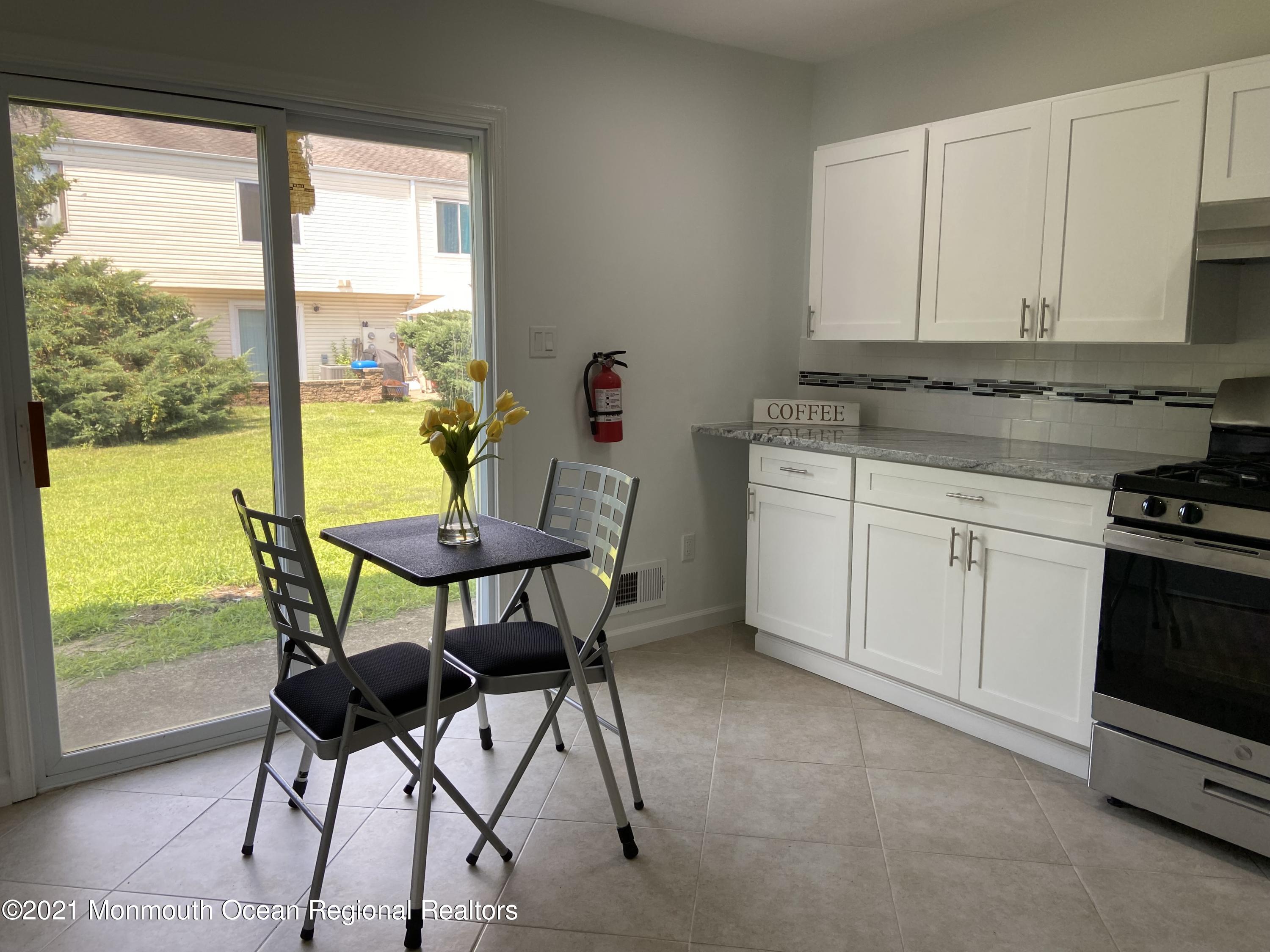 151 Sawmill Road, Unit 265 Brick, NJ 08724 - Photo 5 of 32 Dining Area With Sliders
