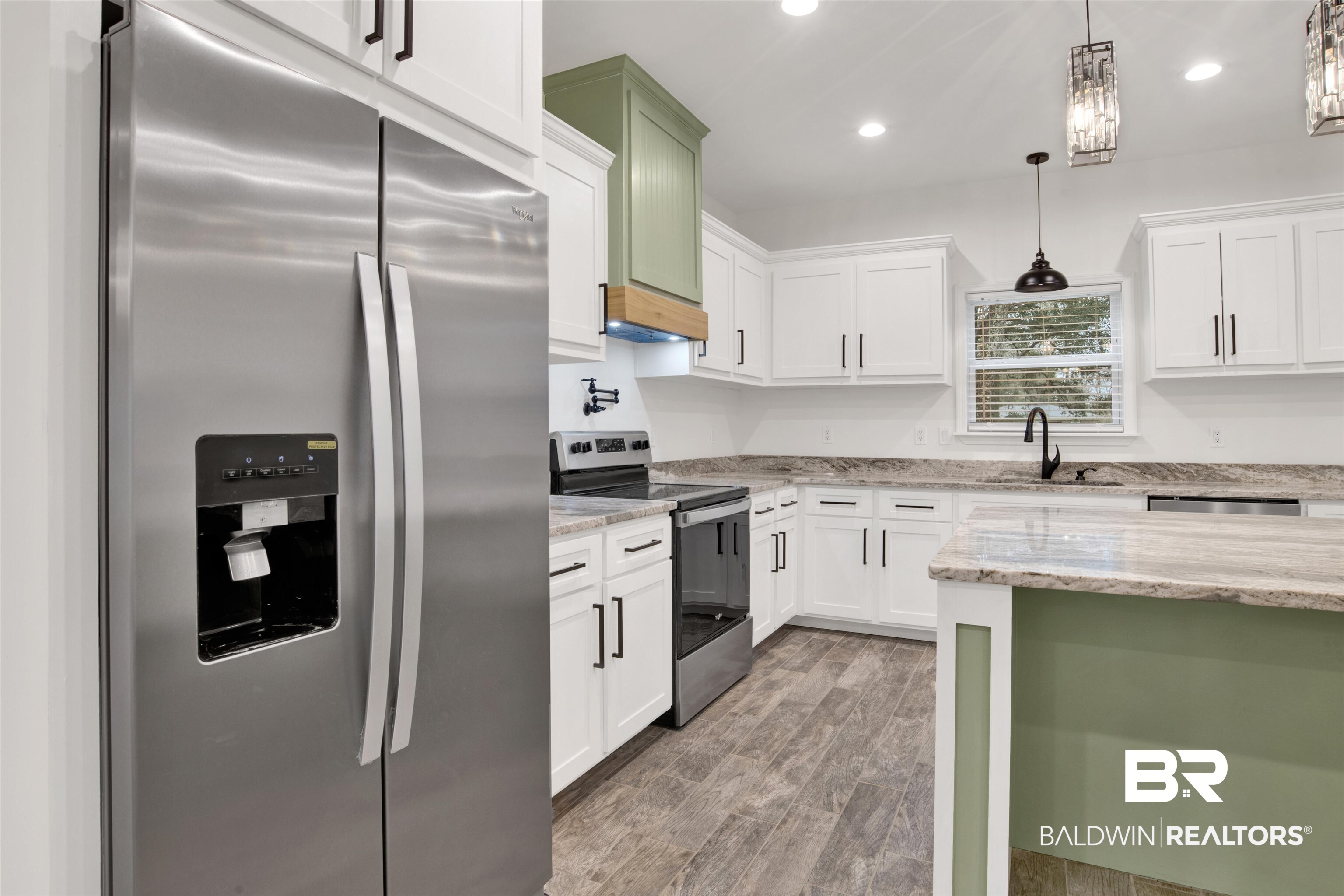 10871 Somerset Road Grand Bay, AL 36541 - Photo 10 of 31 Kitchen featuring appliances with stainless steel finishes, sink, light stone countertops, and decorative light fixtures
