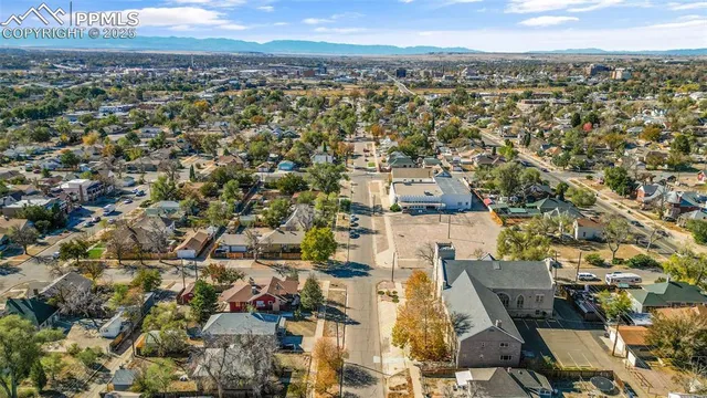 an aerial view of residential houses with outdoor space