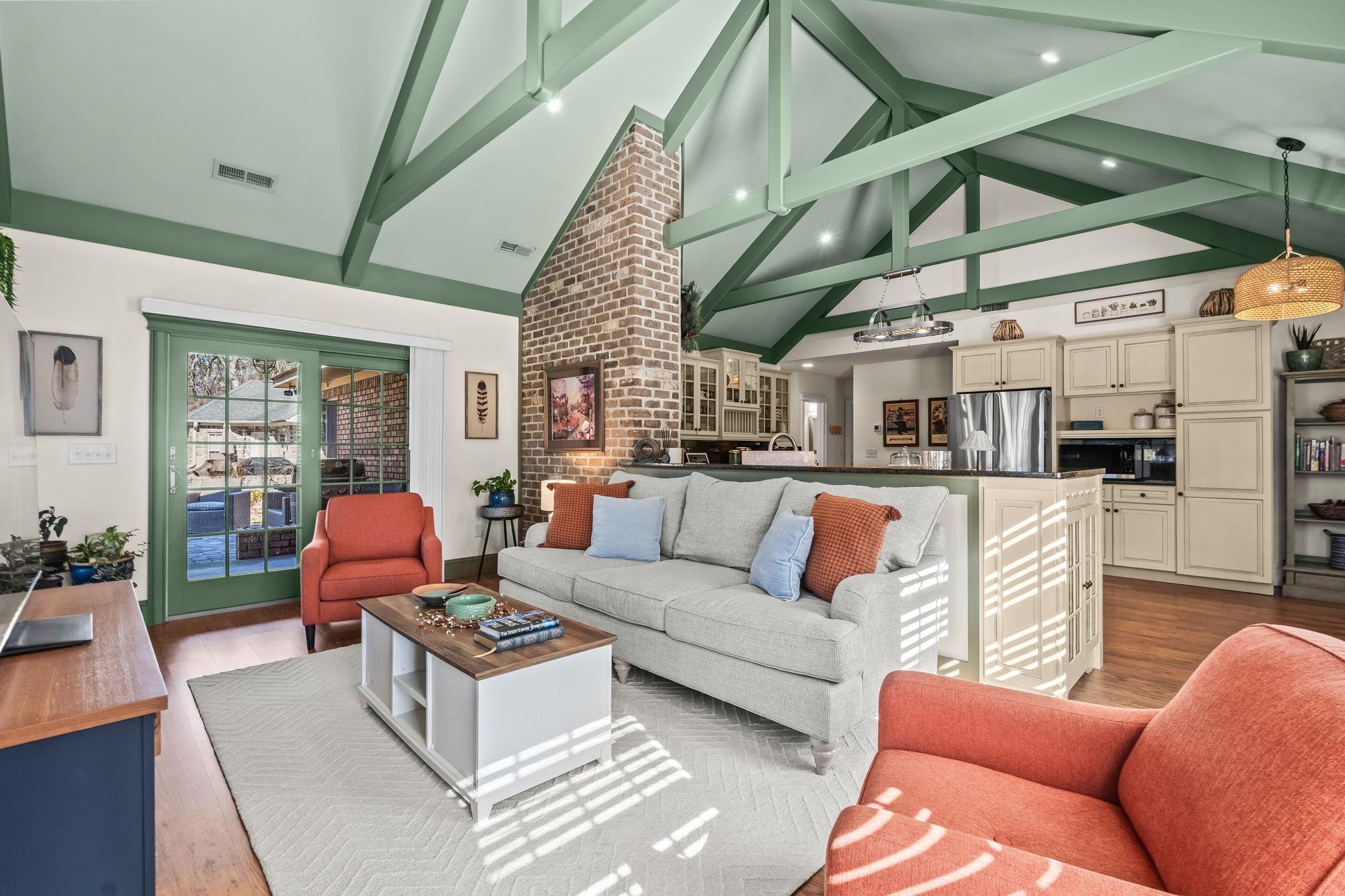 400 Foxtail Drive Longs, SC 29568 - Photo 11 of 40 Living area with high vaulted ceiling, beamed ceiling, and light wood-style floors
