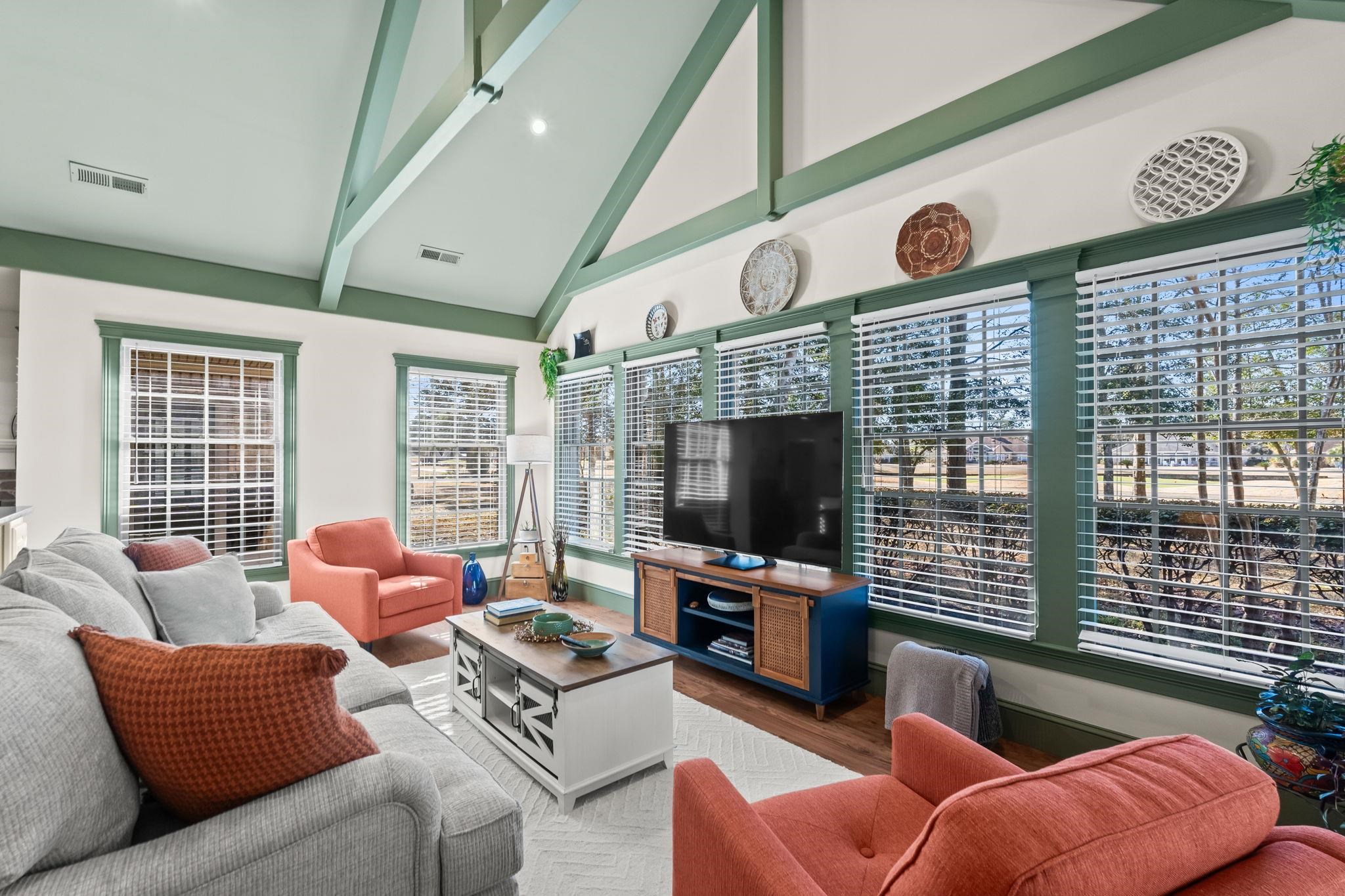 400 Foxtail Drive Longs, SC 29568 - Photo 12 of 40 Living area with high vaulted ceiling, beam ceiling, and wood finished floors