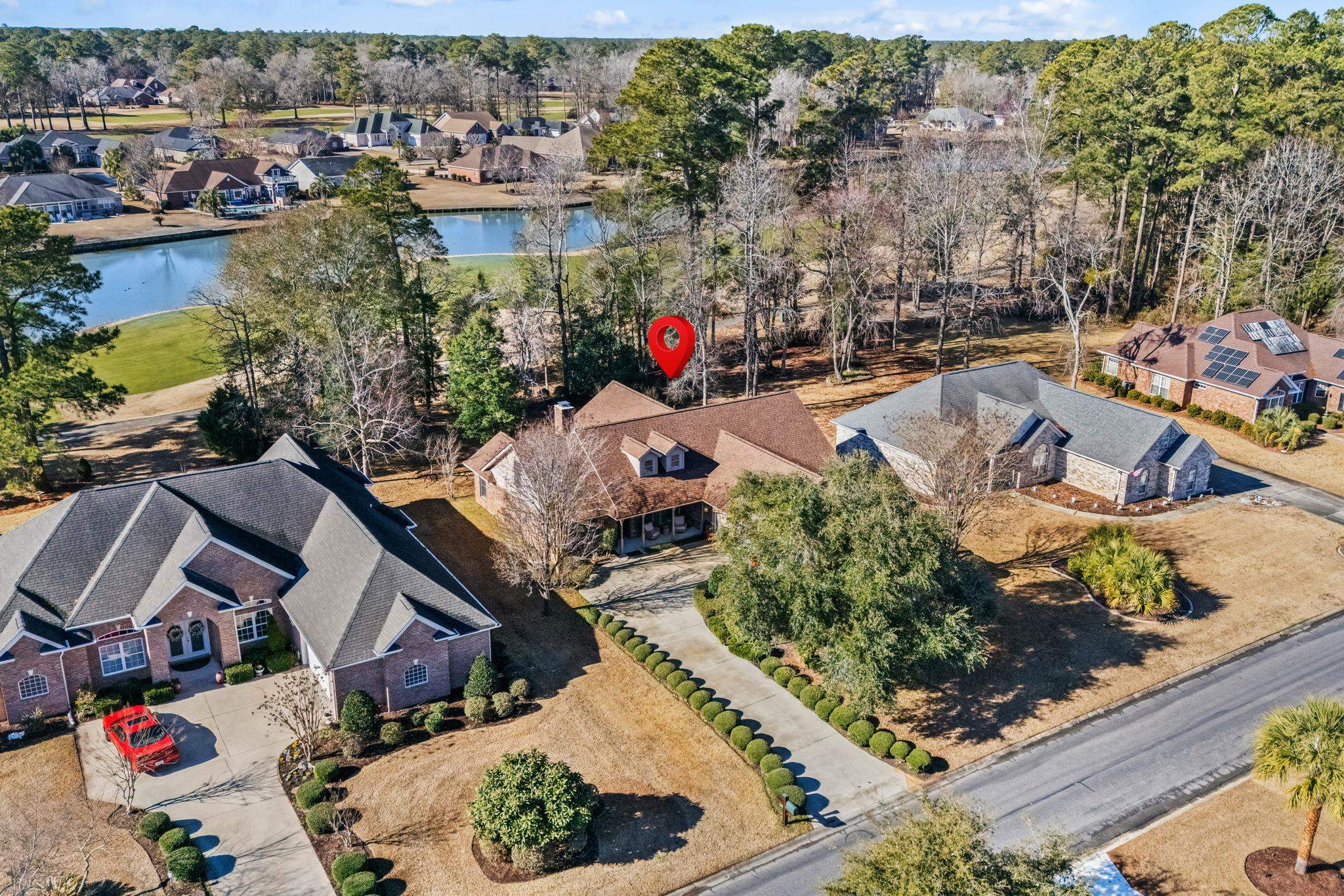 400 Foxtail Drive Longs, SC 29568 - Photo 2 of 40 Aerial view of residential area with a tree filled landscape and a large body of water