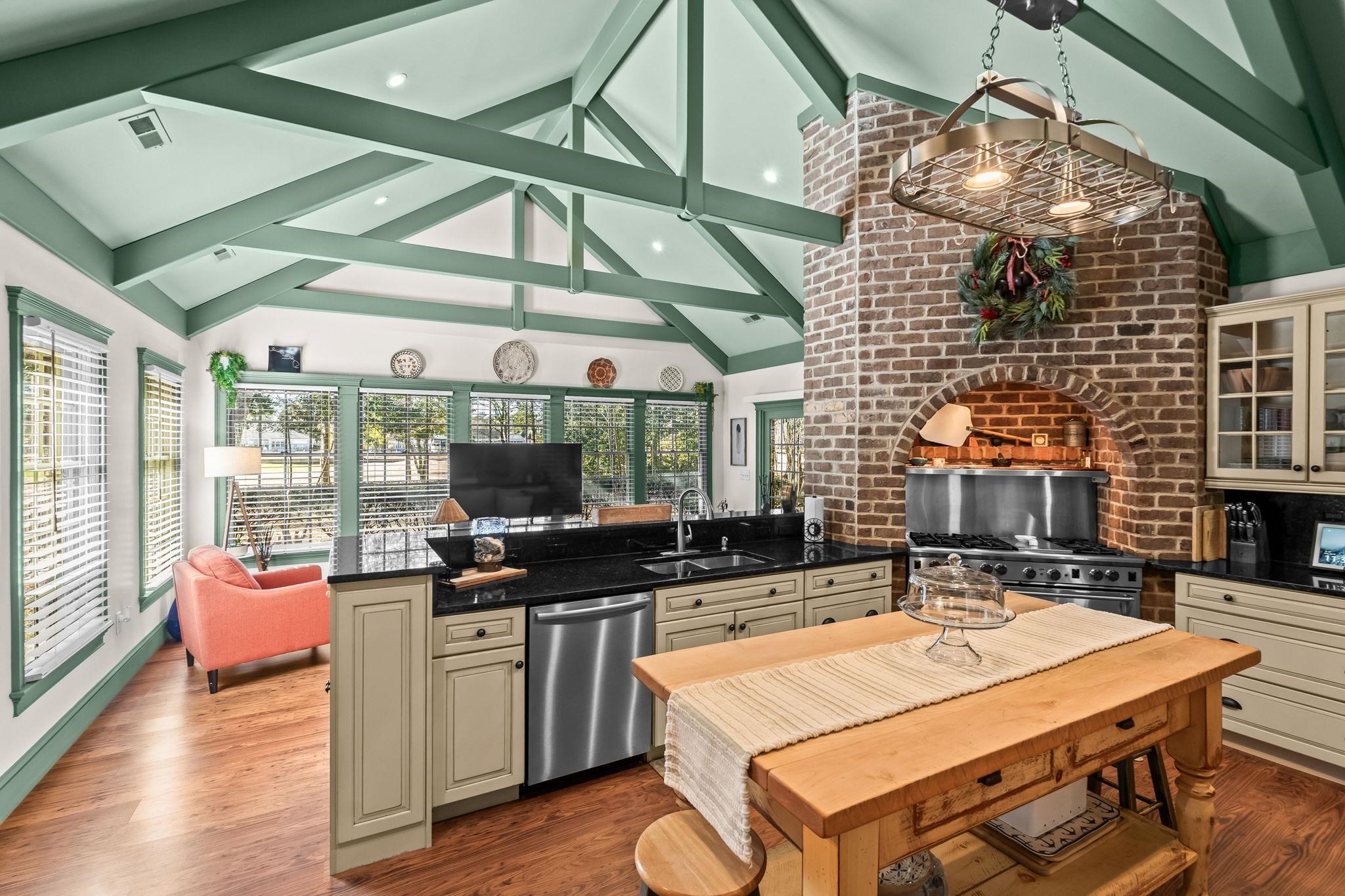400 Foxtail Drive Longs, SC 29568 - Photo 40 of 40 Kitchen with cream cabinetry, stainless steel appliances, open floor plan, dark stone countertops, and high vaulted ceiling