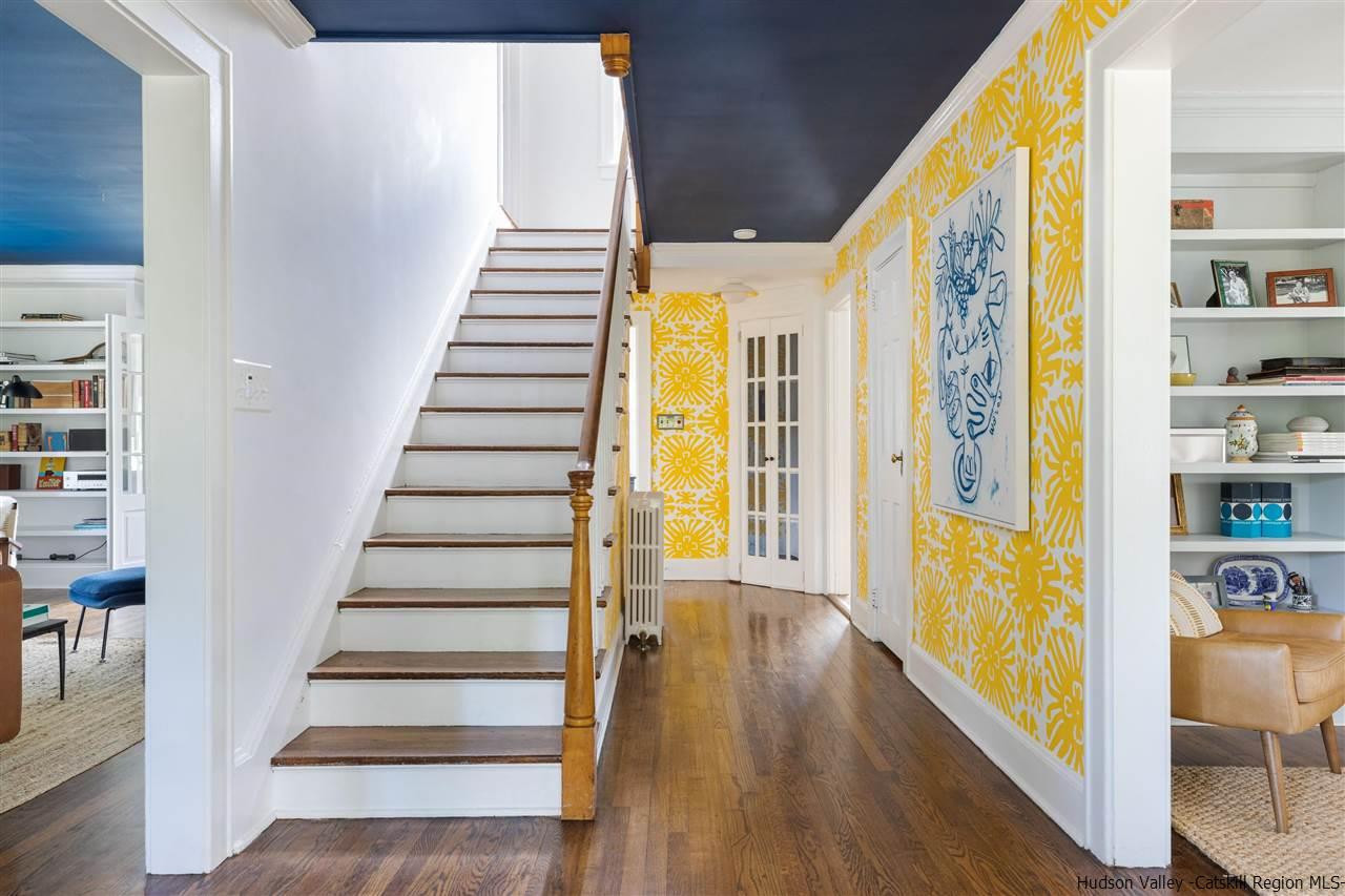 1162 Plains Road Wallkill, NY 12589 - Photo 12 of 35 a view of a hallway with wooden floor and windows