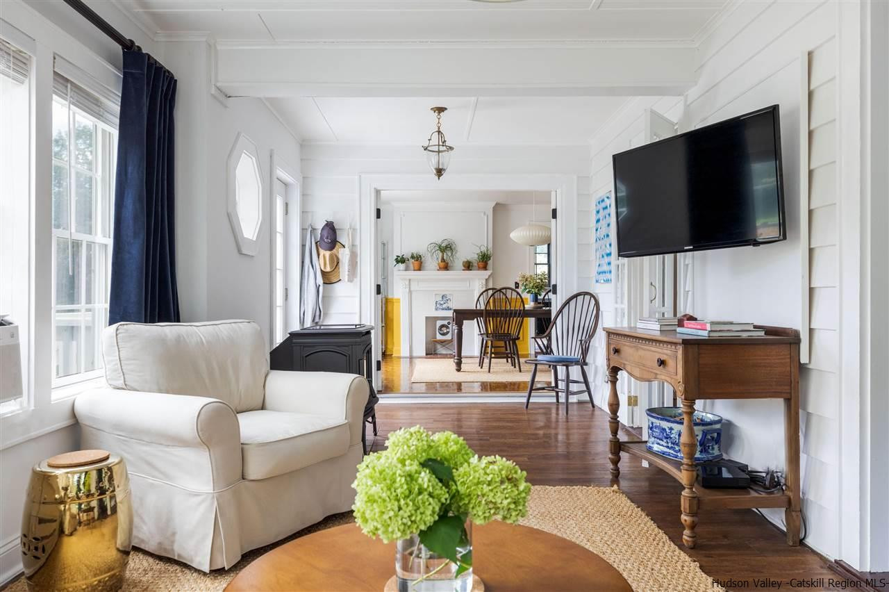 1162 Plains Road Wallkill, NY 12589 - Photo 16 of 35 a living room with furniture and a flat screen tv