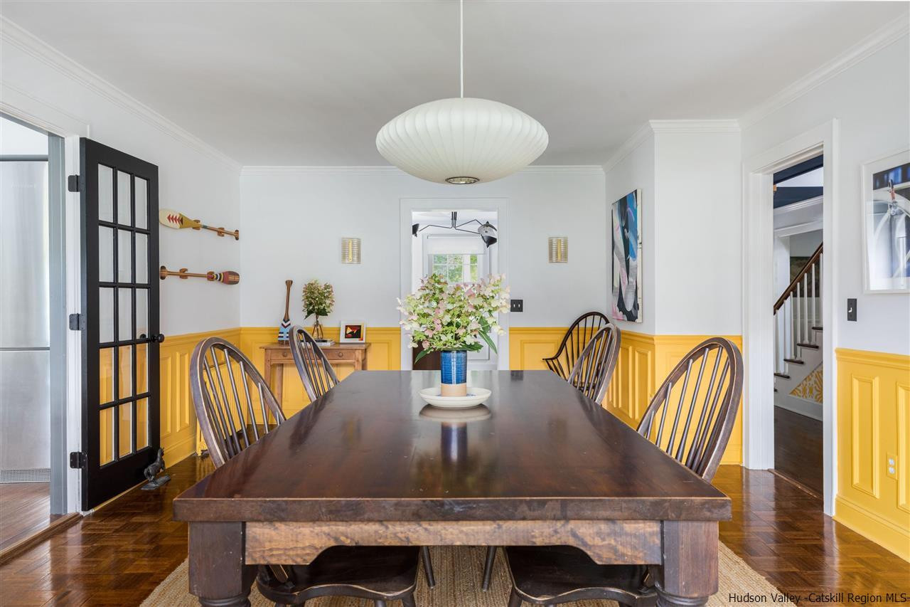 1162 Plains Road Wallkill, NY 12589 - Photo 17 of 35 a view of a dining room with furniture and wooden floor