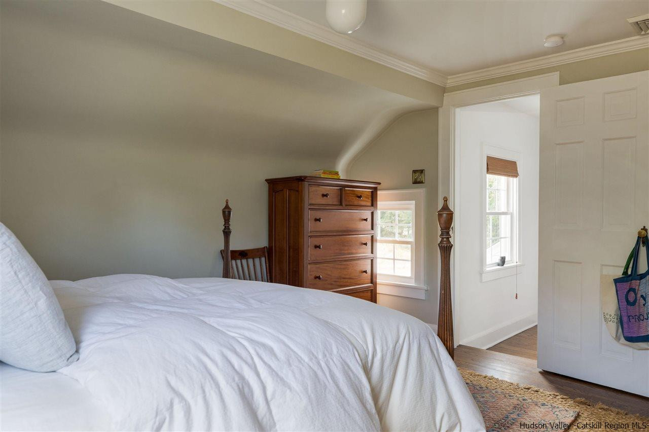 1162 Plains Road Wallkill, NY 12589 - Photo 24 of 35 a bedroom with a bed and a mirror
