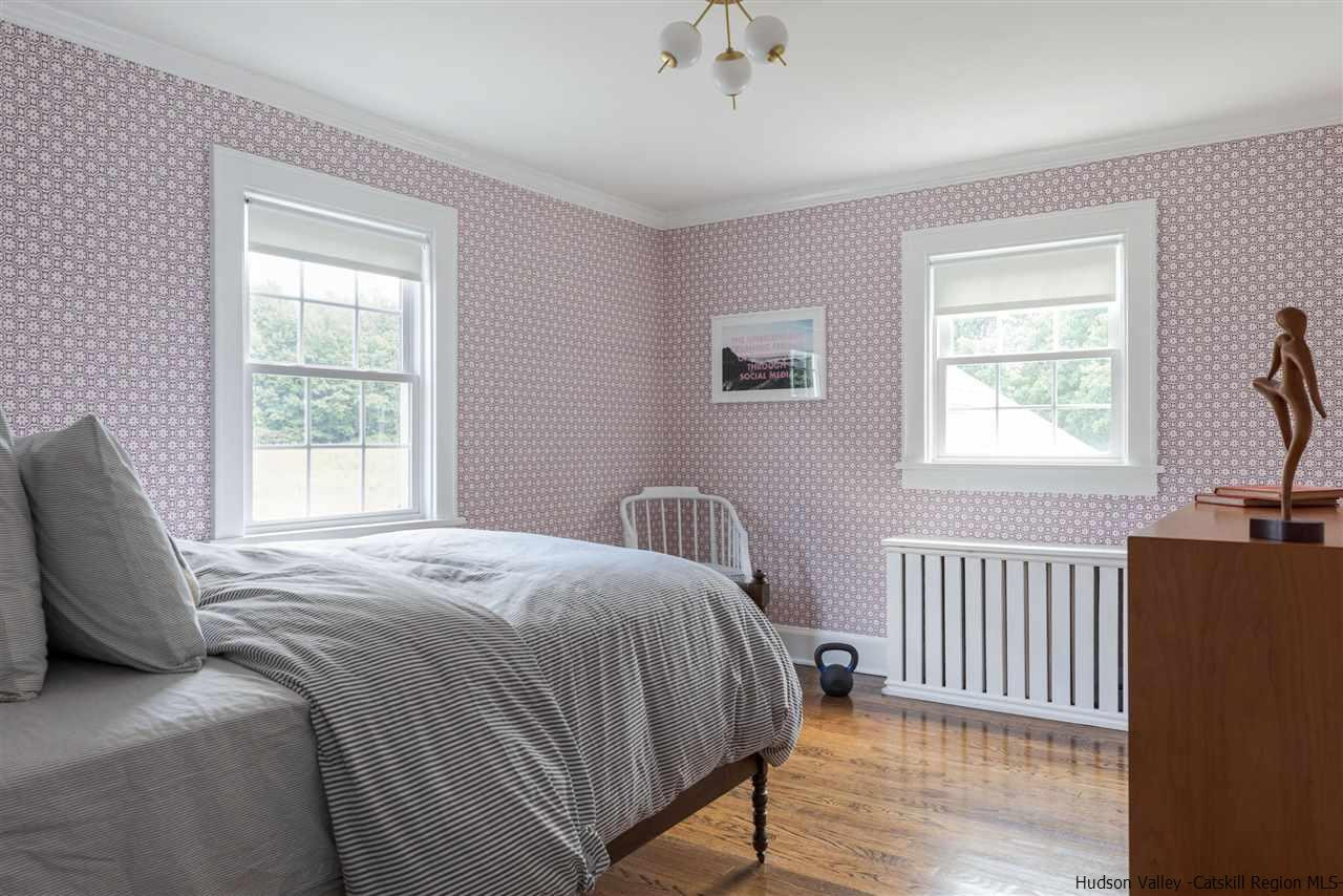 1162 Plains Road Wallkill, NY 12589 - Photo 25 of 35 a bedroom with a bed and a window