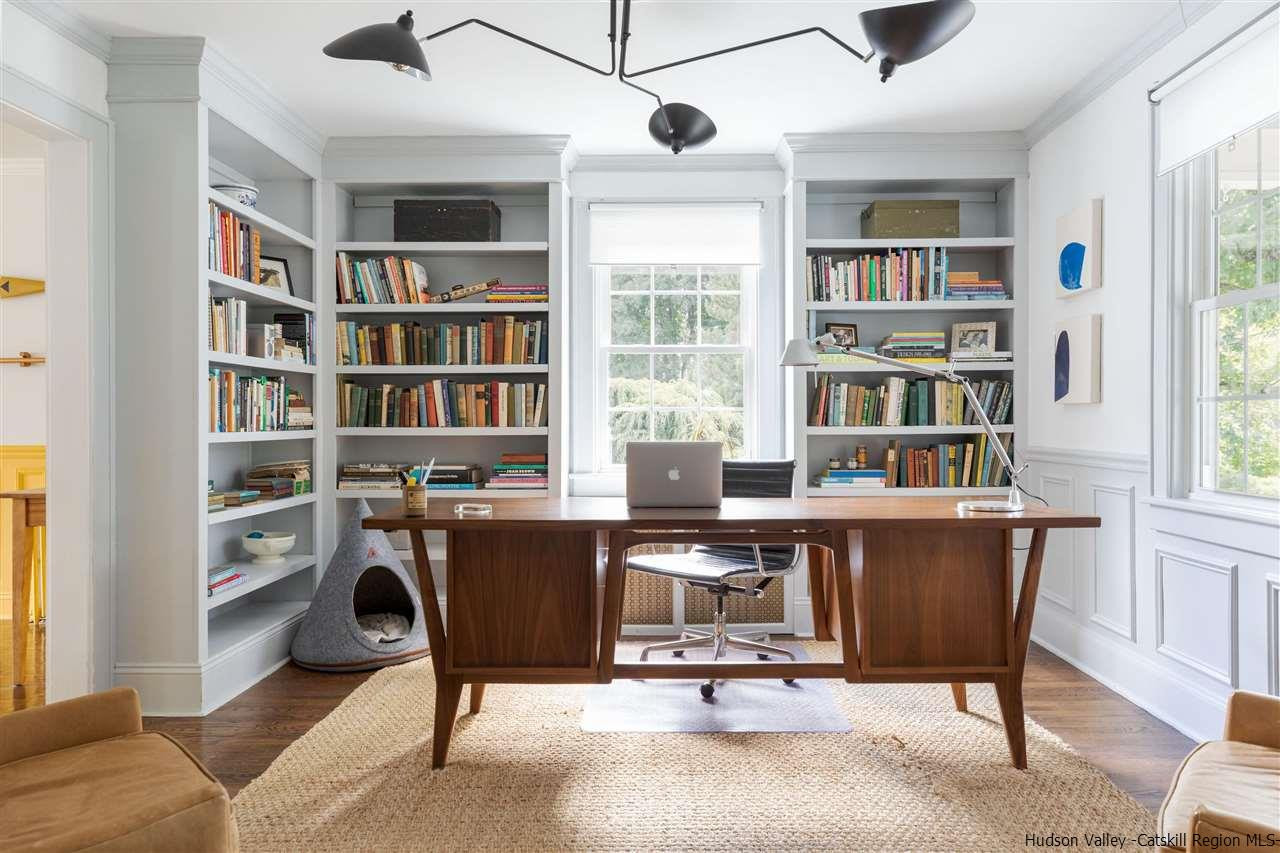 1162 Plains Road Wallkill, NY 12589 - Photo 6 of 35 a view of a livingroom with workspace and a window