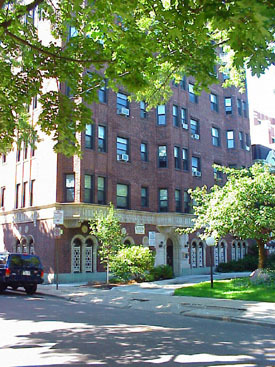 a front view of a building with garden