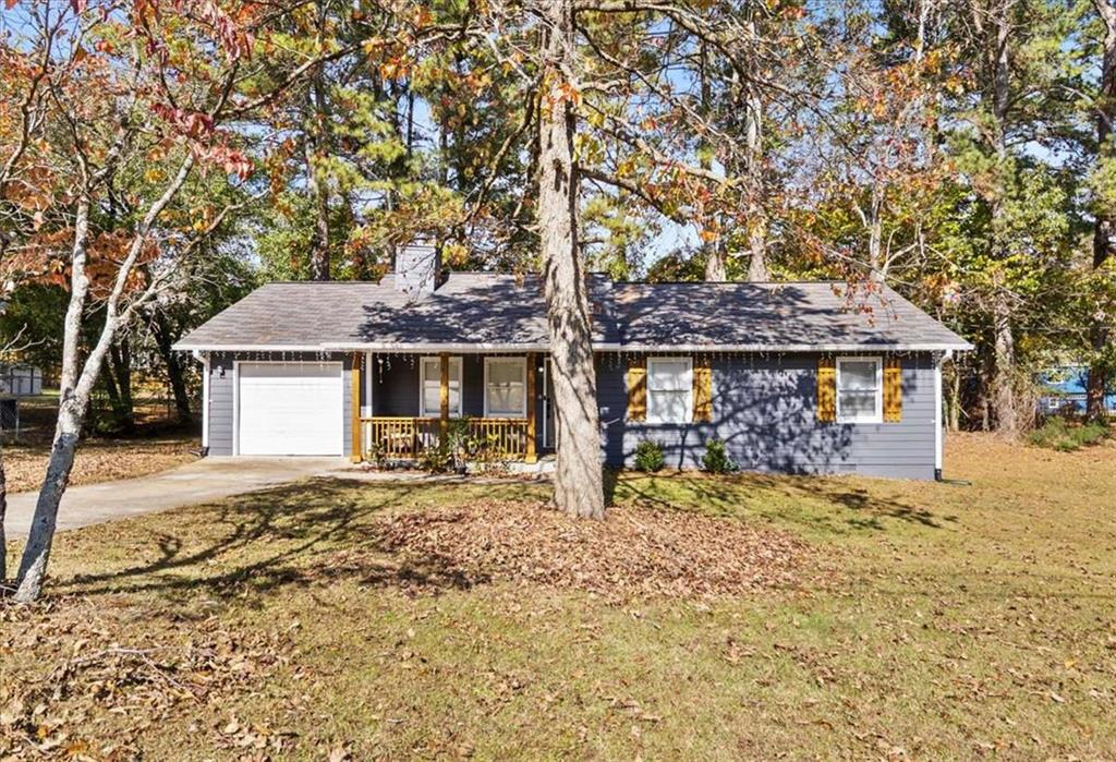 1737 Litchfield Road Southwest Snellville, GA 30078 - Photo 1 of 1 a front view of a house with garden