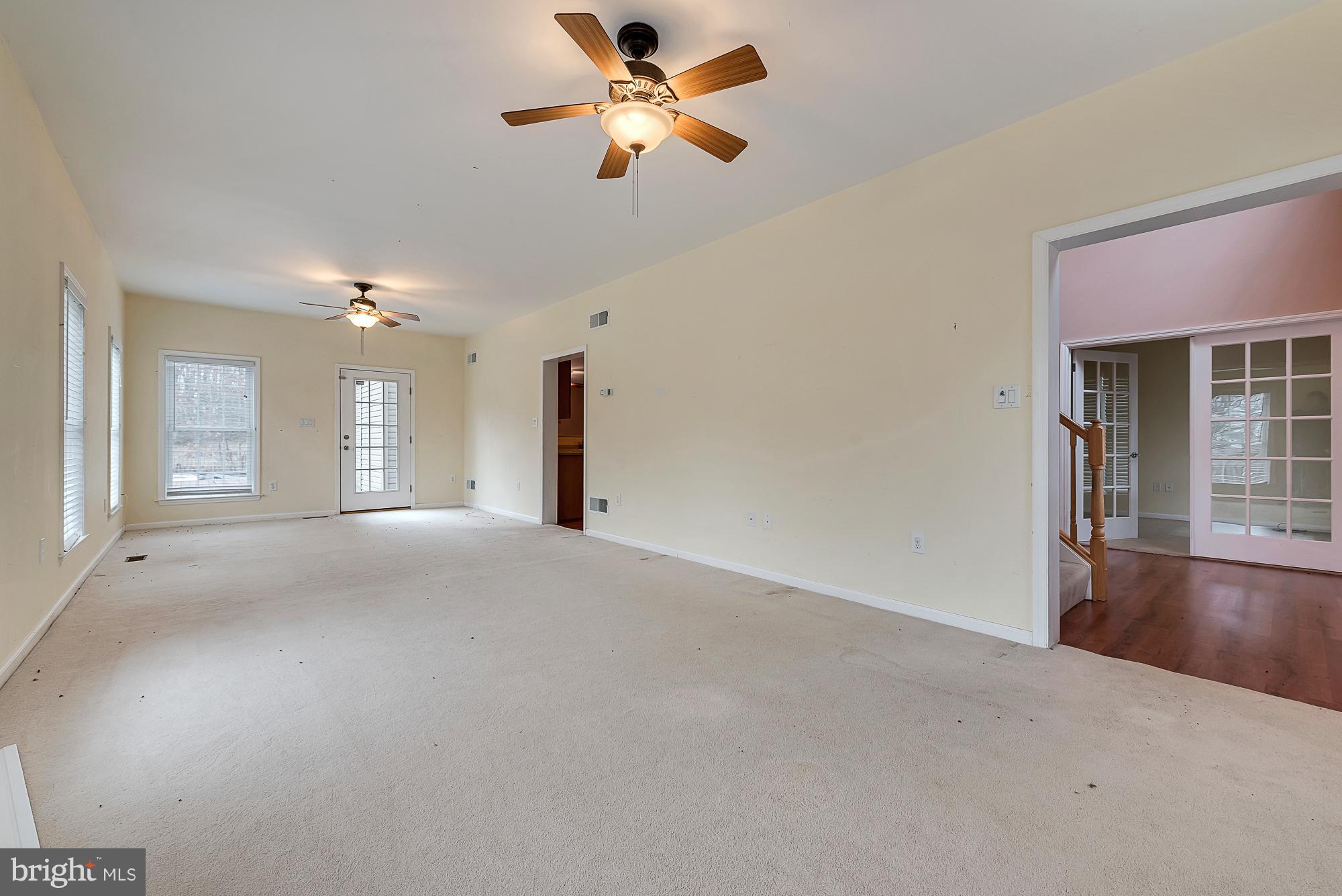 11698 Coppermine Road Union Bridge, MD 21791 - Photo 11 of 24 a view of a livingroom with a ceiling fan and window