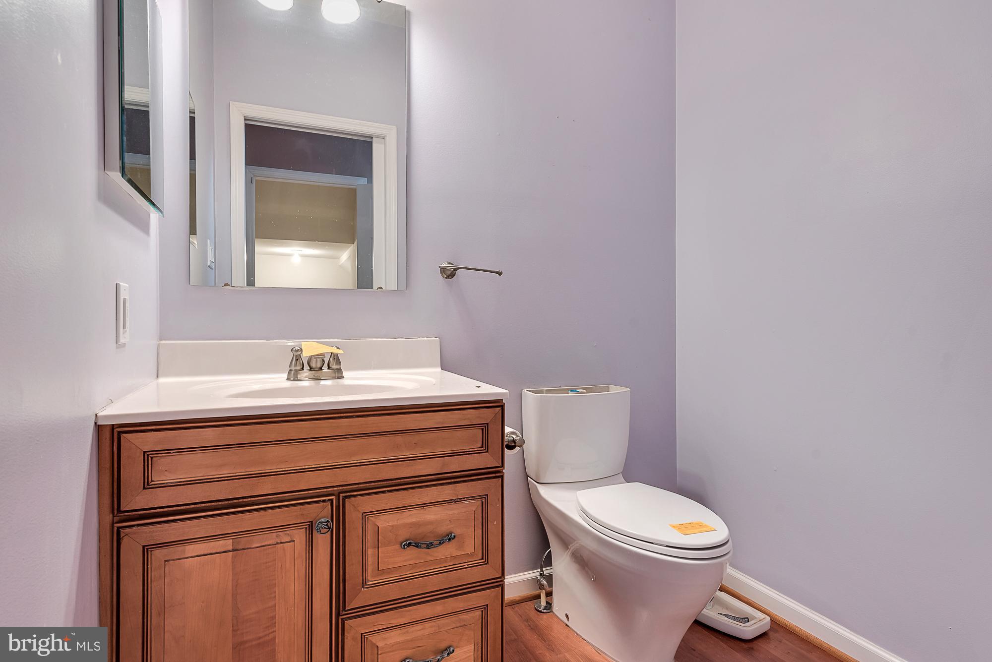 11698 Coppermine Road Union Bridge, MD 21791 - Photo 21 of 24 a white toilet sitting next to a bathroom sink