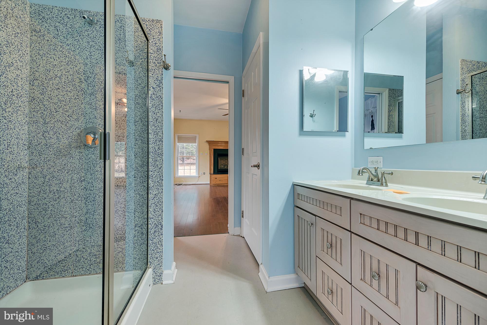 11698 Coppermine Road Union Bridge, MD 21791 - Photo 23 of 24 a bathroom with a double vanity sink and a mirror