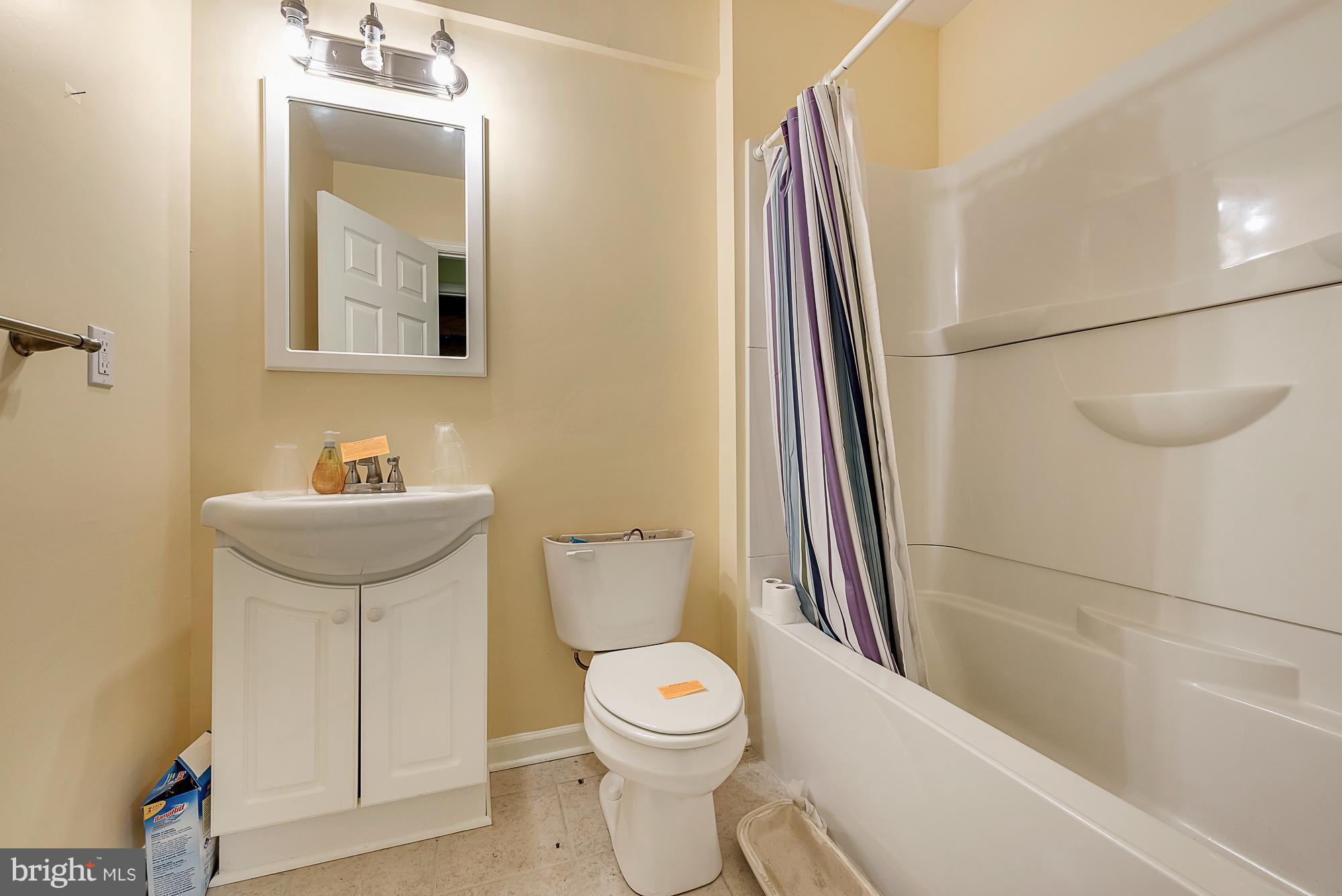 11698 Coppermine Road Union Bridge, MD 21791 - Photo 24 of 24 a bathroom with a toilet a sink and a mirror