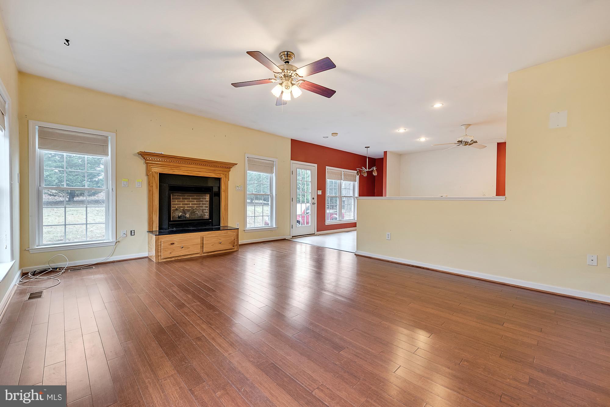 11698 Coppermine Road Union Bridge, MD 21791 - Photo 7 of 24 a view of an empty room with window and wooden floor