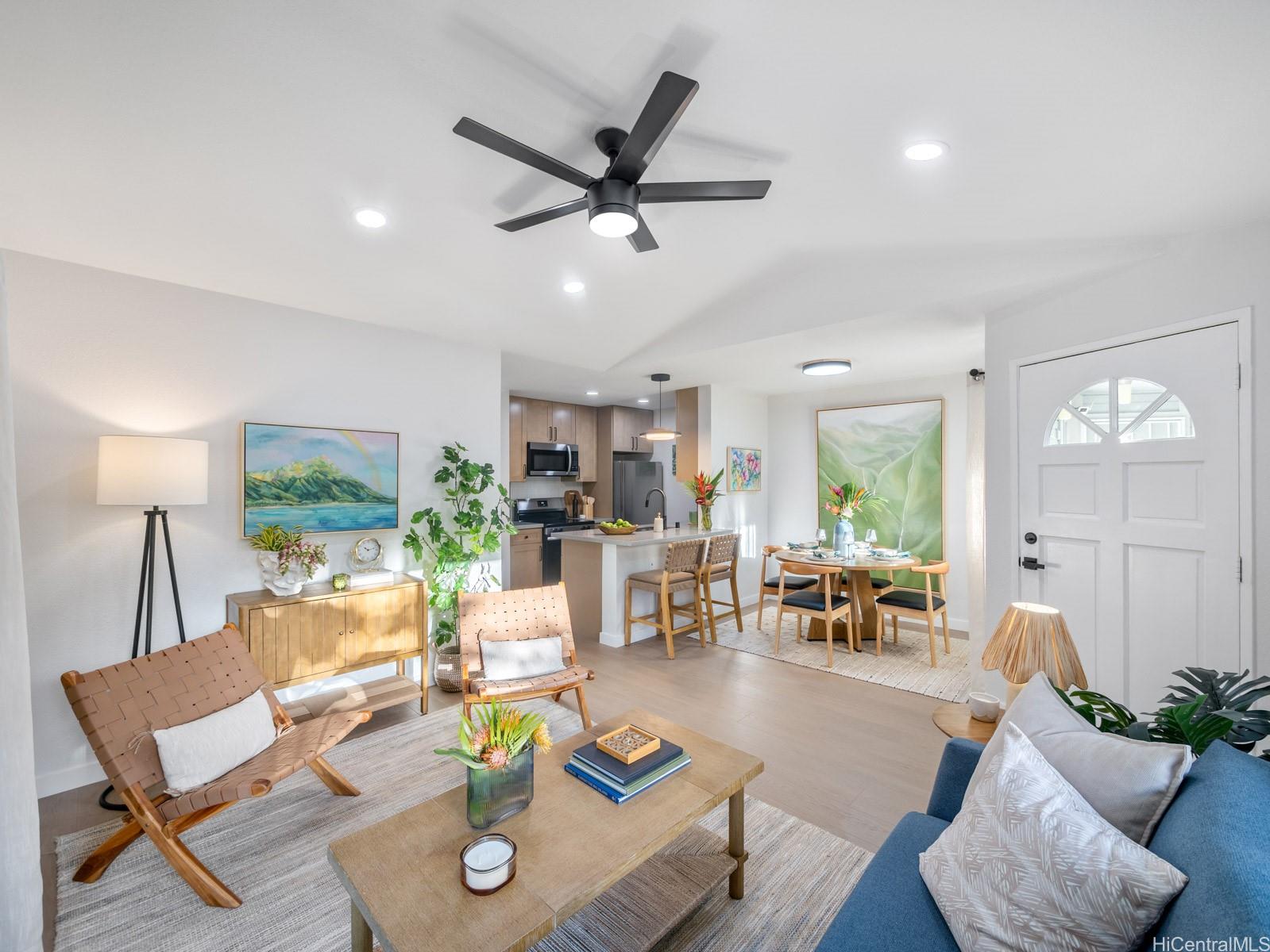 95-664 Wikao Street, Unit L205 Mililani, HI 96789 - Photo 1 of 25 a living room with furniture and a window
