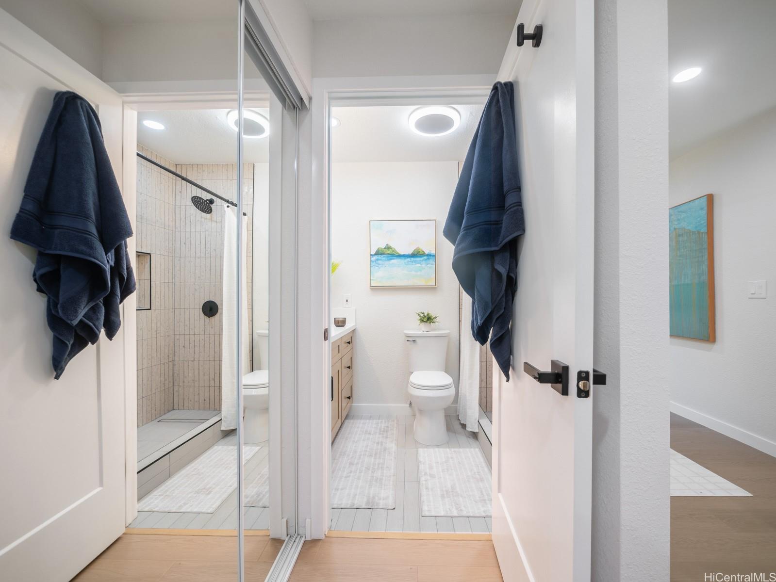 95-664 Wikao Street, Unit L205 Mililani, HI 96789 - Photo 16 of 25 a bathroom with a sink toilet and shower