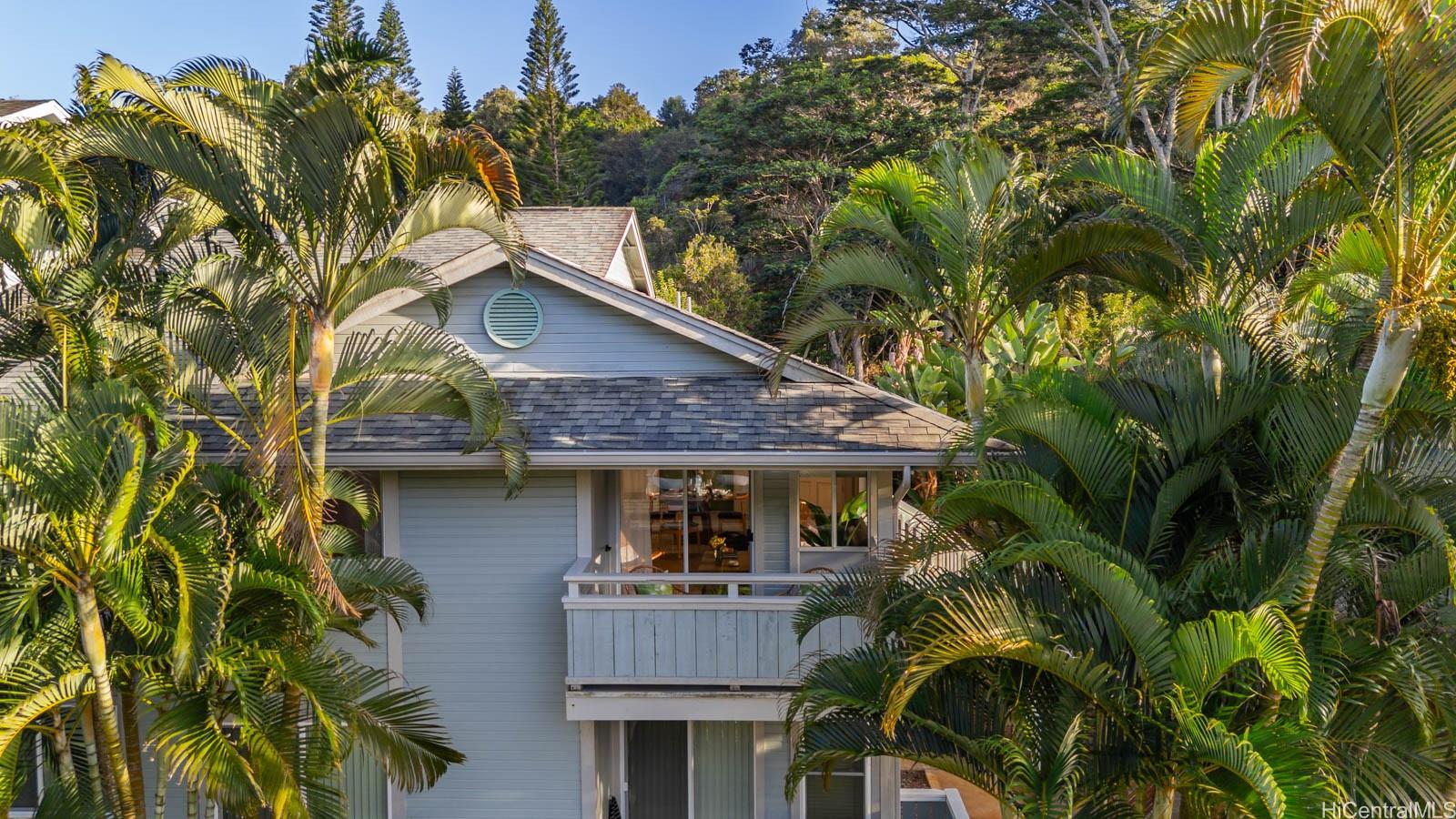 95-664 Wikao Street, Unit L205 Mililani, HI 96789 - Photo 24 of 25 a front view of a house with a garden