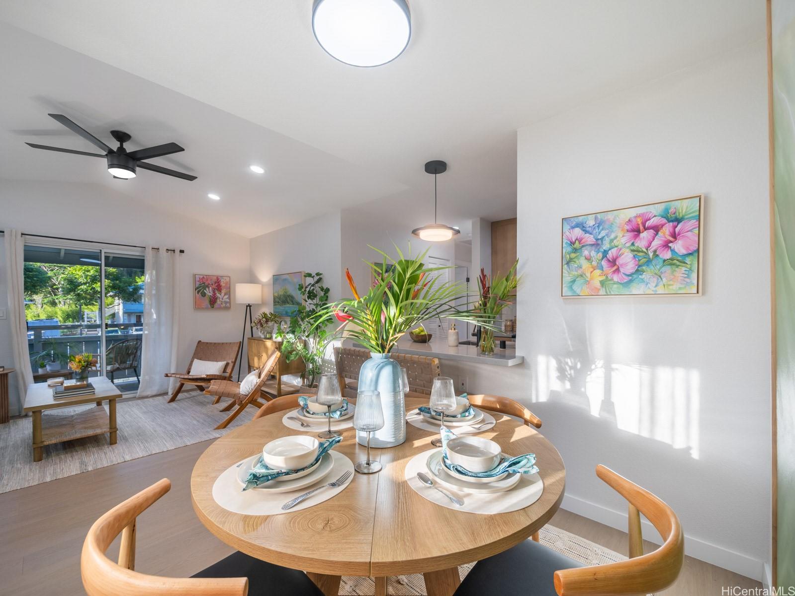 95-664 Wikao Street, Unit L205 Mililani, HI 96789 - Photo 4 of 25 a view of a dining room with furniture