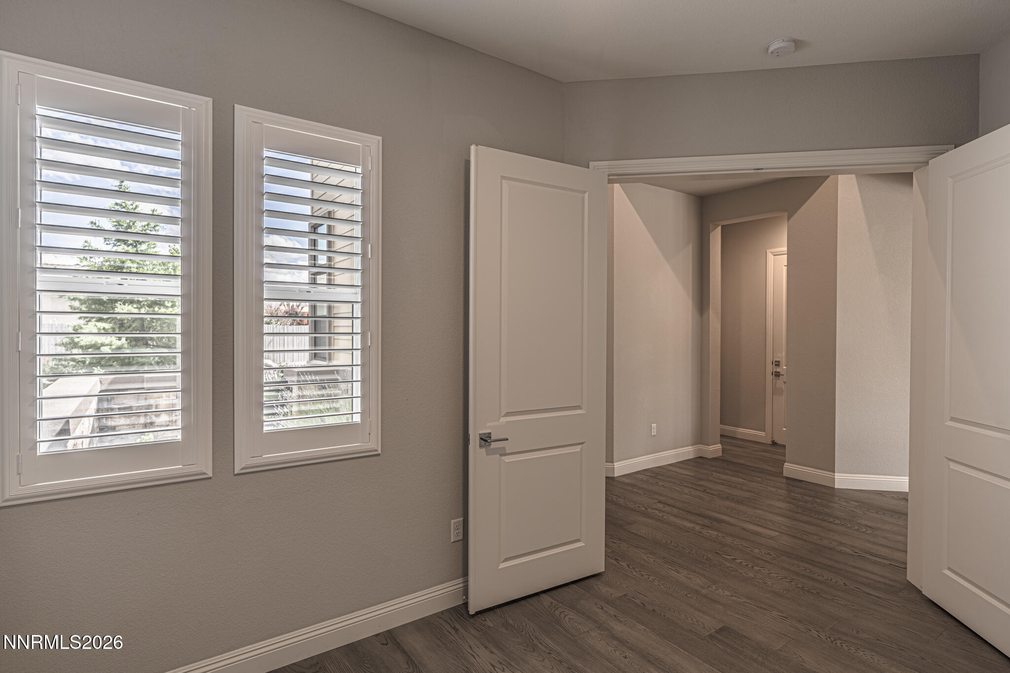 2109 Cast Iron Drive Reno, NV 89521 - Photo 11 of 35 a view of an empty room with wooden floor and a window