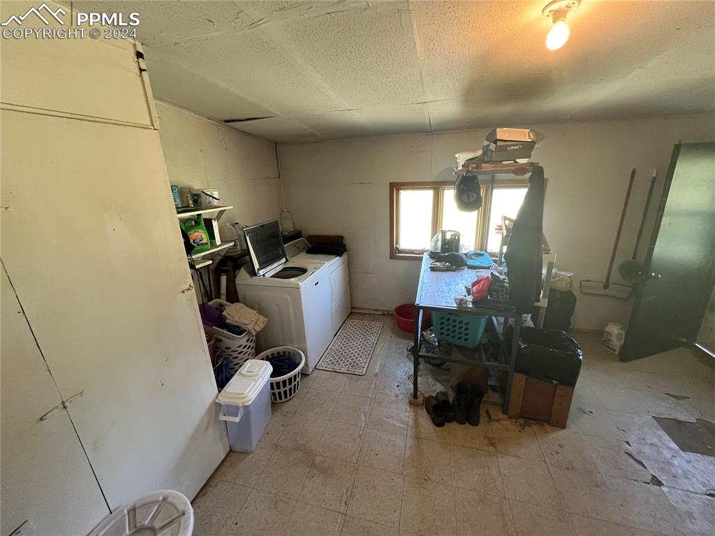 5576 County Rd G Joes, CO 80822 - Photo 12 of 30 Kitchen with a paneled ceiling and light tile floors