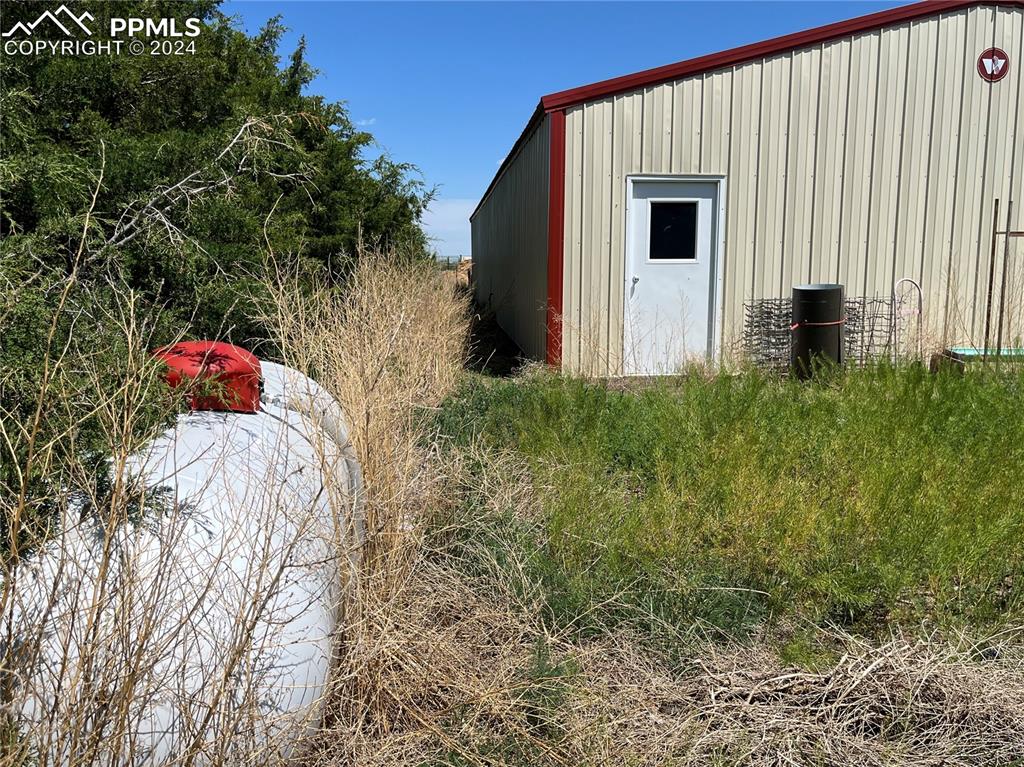 5576 County Rd G Joes, CO 80822 - Photo 16 of 30 a front view of a house with a yard