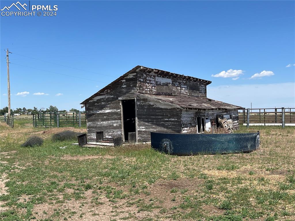 5576 County Rd G Joes, CO 80822 - Photo 25 of 30 a view of a large building with a yard
