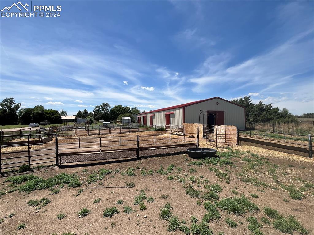 5576 County Rd G Joes, CO 80822 - Photo 27 of 30 View of yard featuring an outdoor structure and a rural view