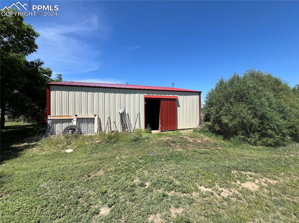 5576 County Rd G Joes, CO 80822 - Photo 28 of 30 a backyard of a house with a garden and yard