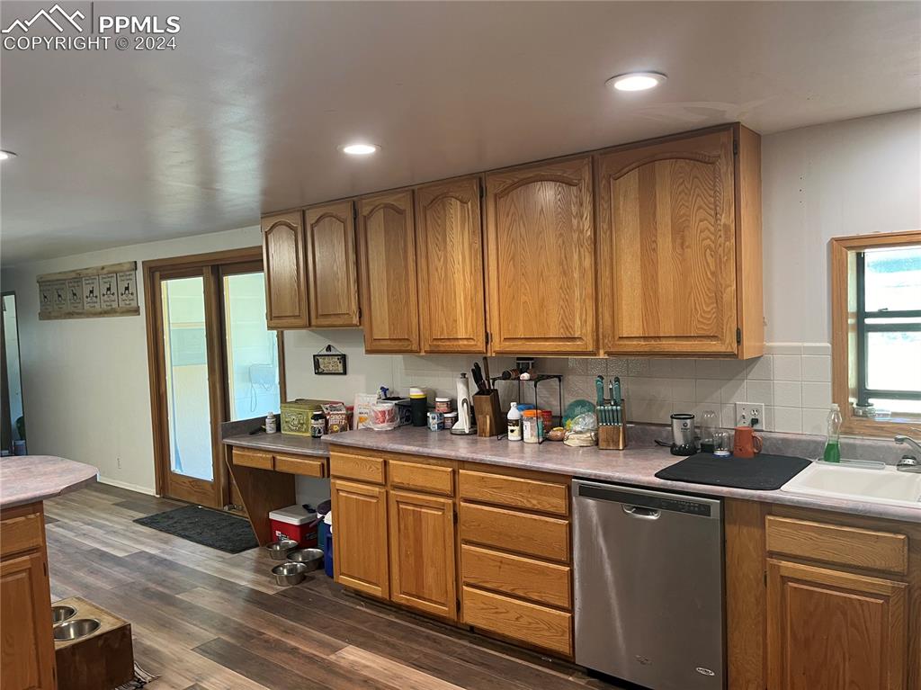 5576 County Rd G Joes, CO 80822 - Photo 3 of 30 a kitchen with a sink cabinets and wooden floor