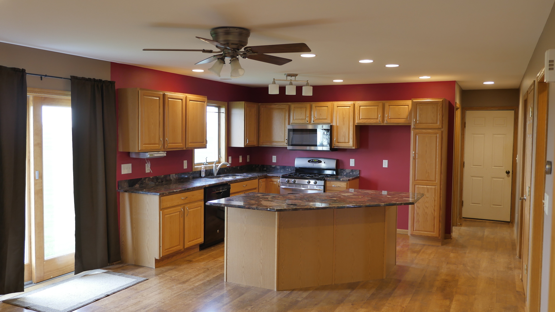 874 North 36th Road Utica, IL 61373 - Photo 3 of 14 a kitchen with stainless steel appliances granite countertop a sink stove and refrigerator