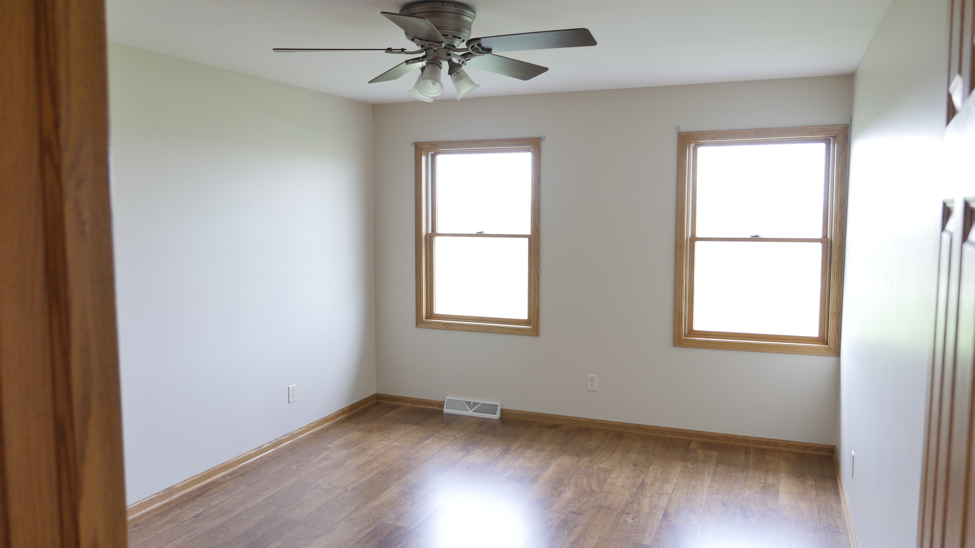 874 North 36th Road Utica, IL 61373 - Photo 4 of 14 an empty room with wooden floor closet and windows